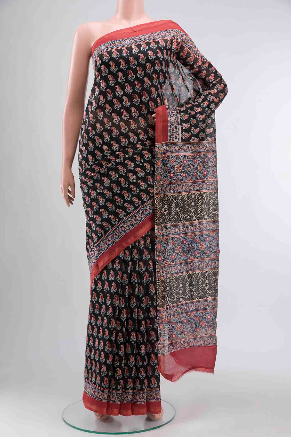 Black Silk Cotton Saree with Printed design on the body and Zari Border displayed on a mannequin