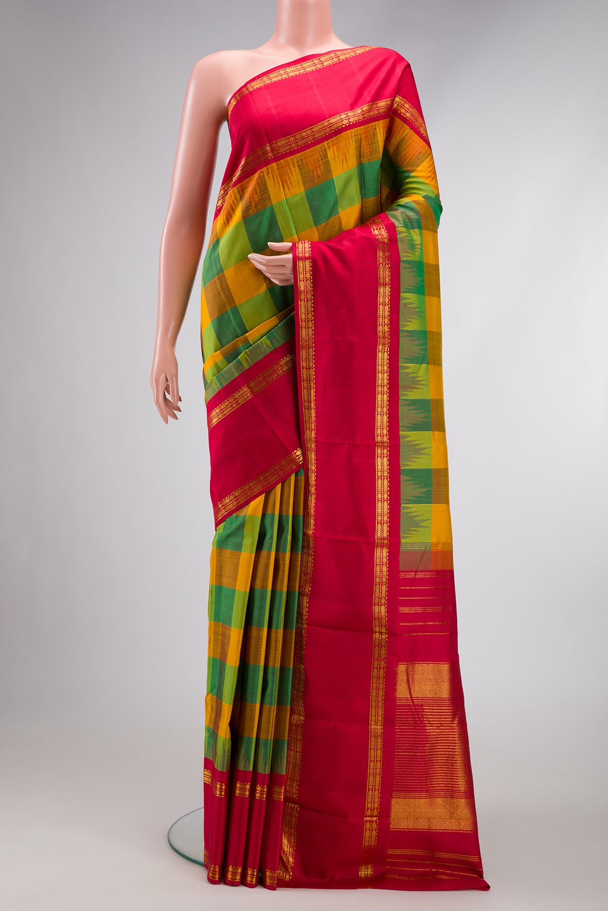 Mustard, Parrot Green and Bottle Green Color Kanjivaram Silk Saree with Checked design on the body and Temple Border.  displayed on a mannequin