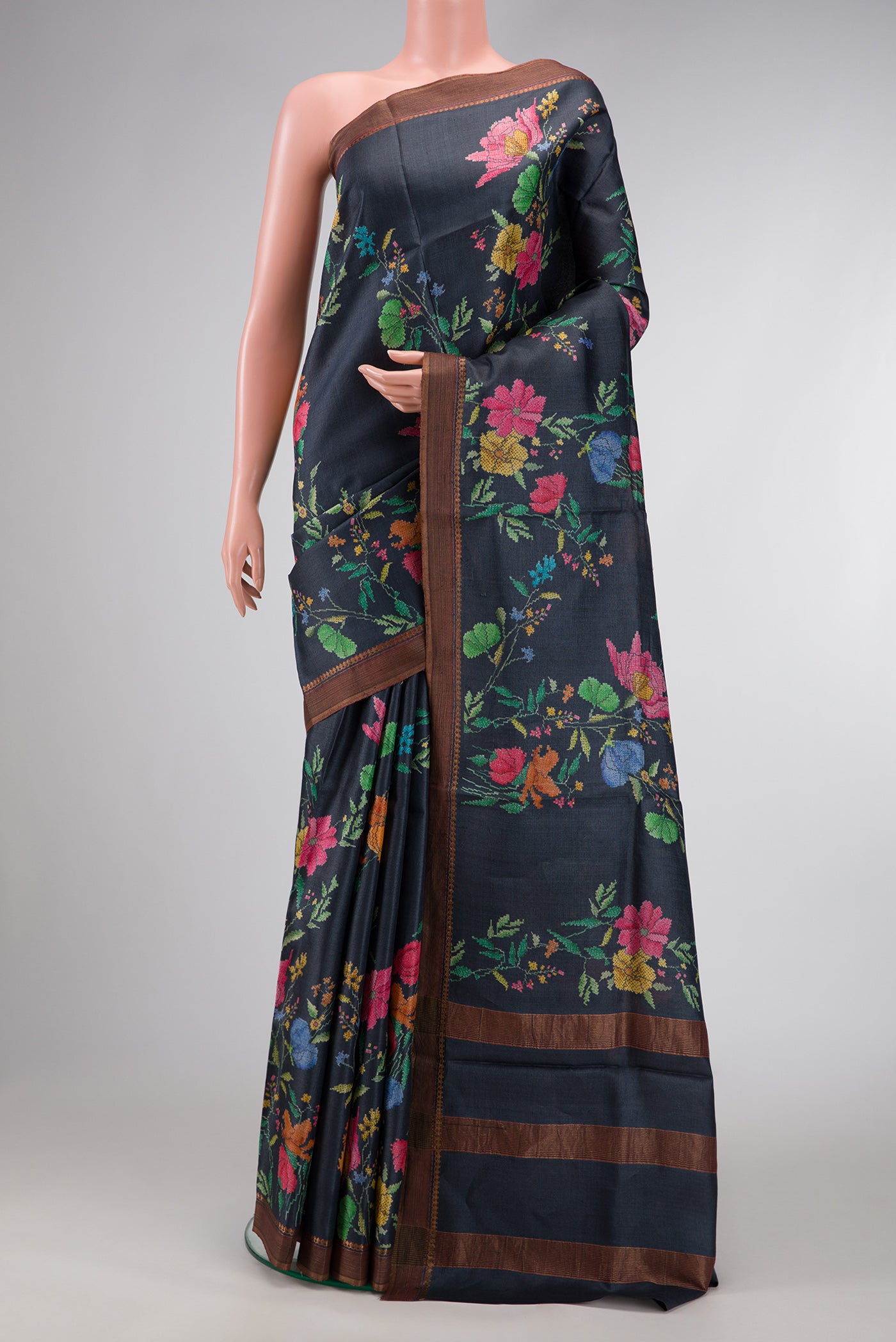 Navy Blue Dual Tone Tussar Silk Saree with Printed design on the body and Zari Border.  displayed on a mannequin