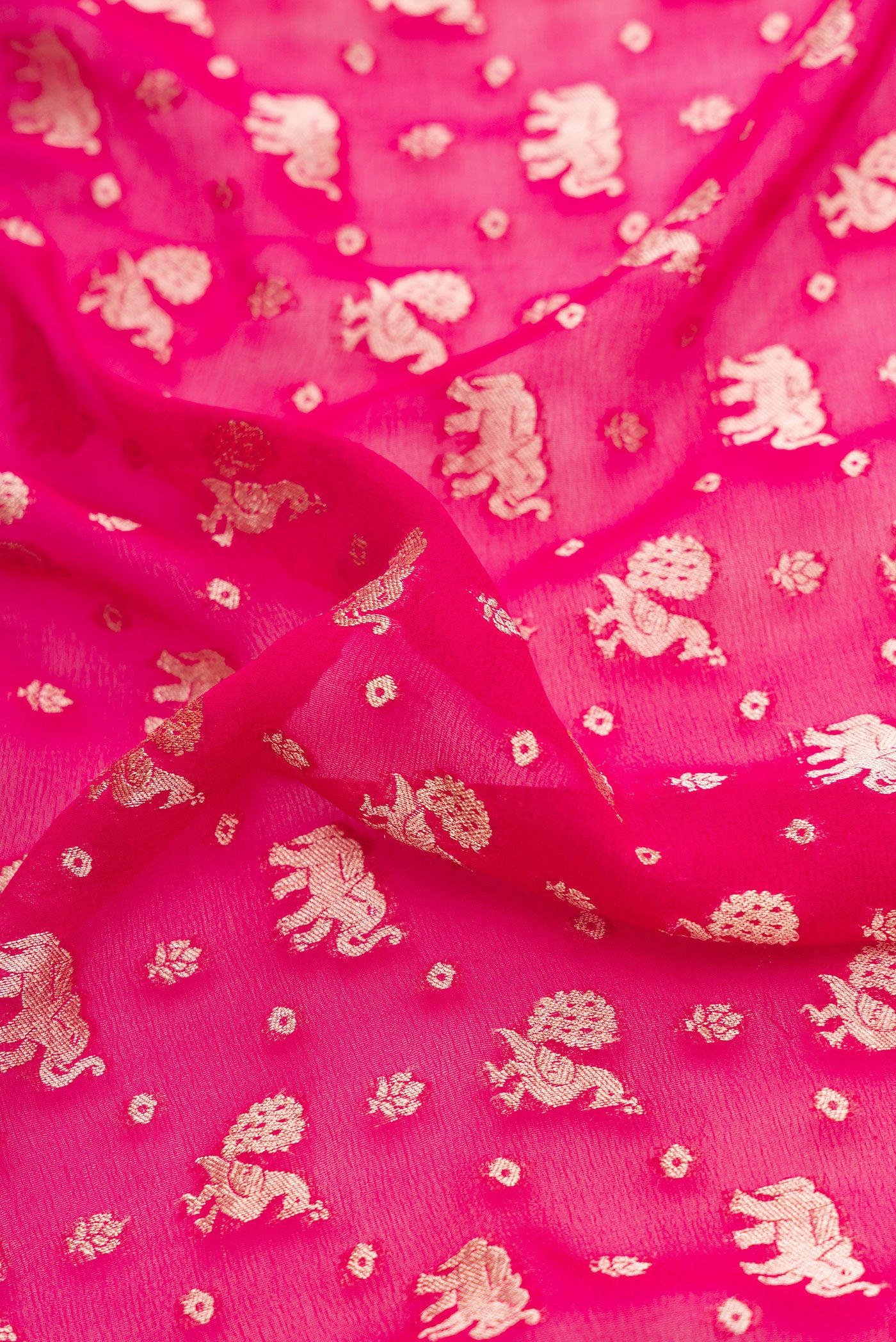 Close up of Pink Dual Tone Banarasi Georgette Saree with Zari Brocade on the body and Fancy Border.  displaying folds