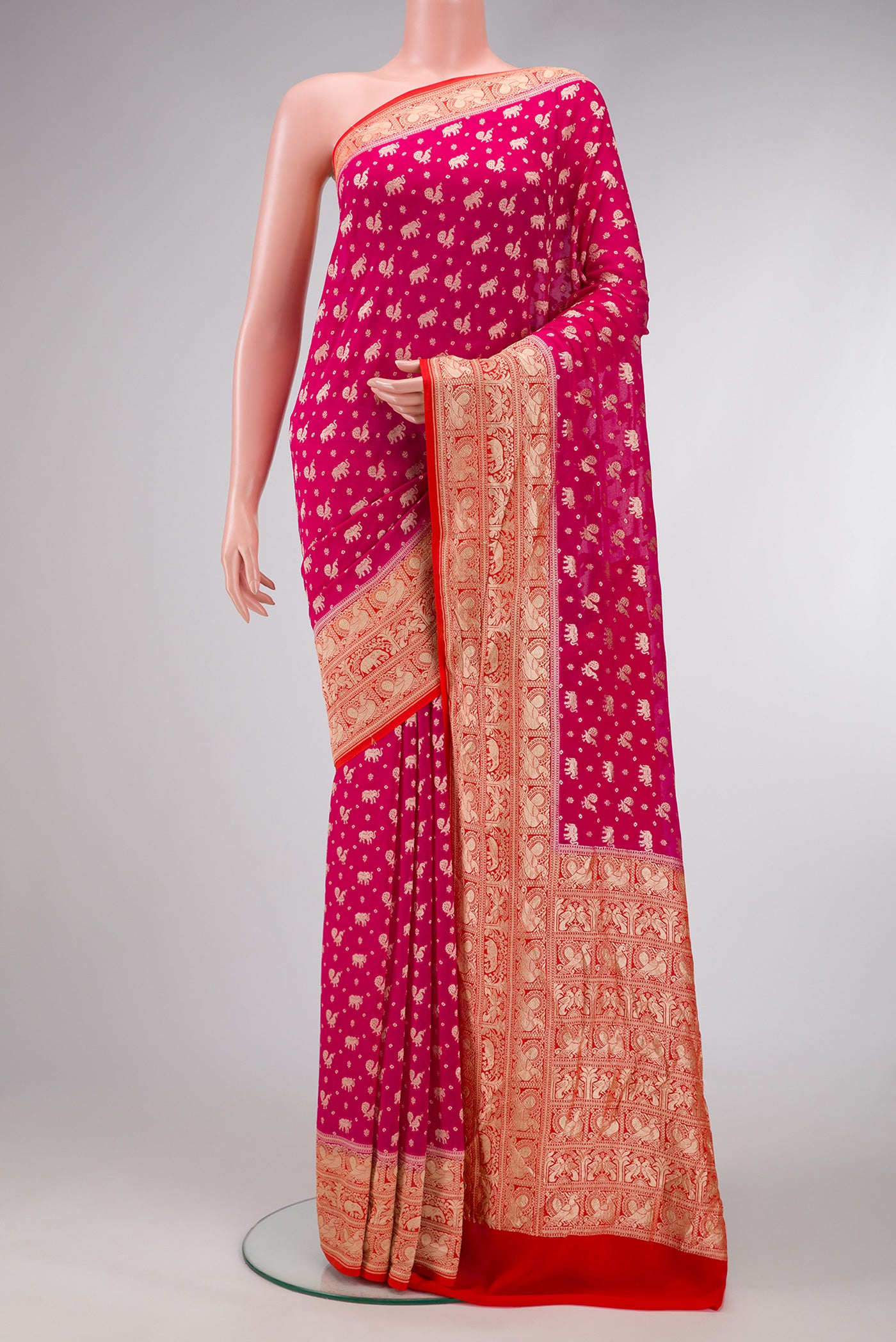 Pink Dual Tone Banarasi Georgette Saree with Zari Brocade on the body and Fancy Border.  displayed on a mannequin