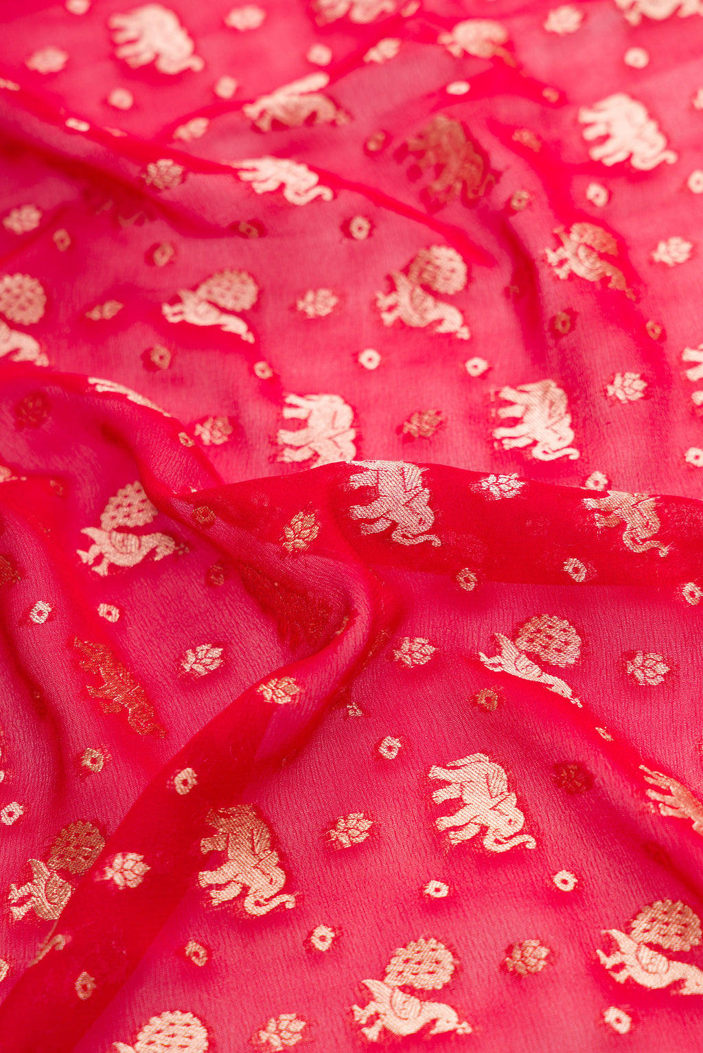 Close up of Maroon Dual Tone Banarasi Georgette Saree with Zari Butta on the body and Zari Border.  displaying folds