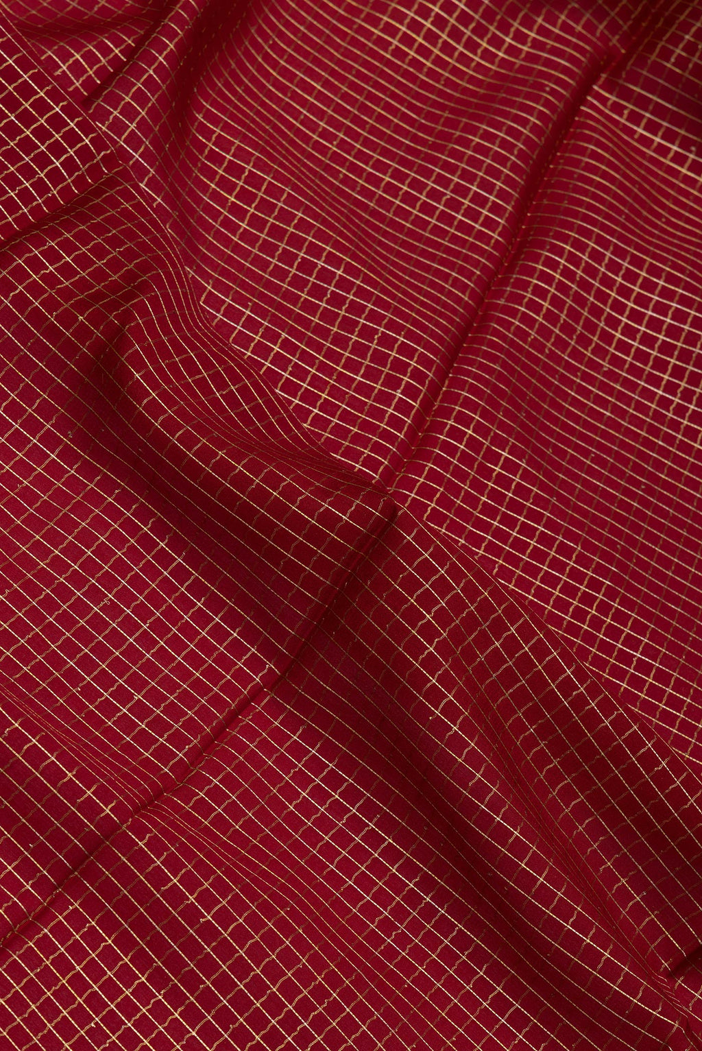 Close up of Maroon Mysore Silk Saree with Checked design on the body and Zari Border.  displaying folds