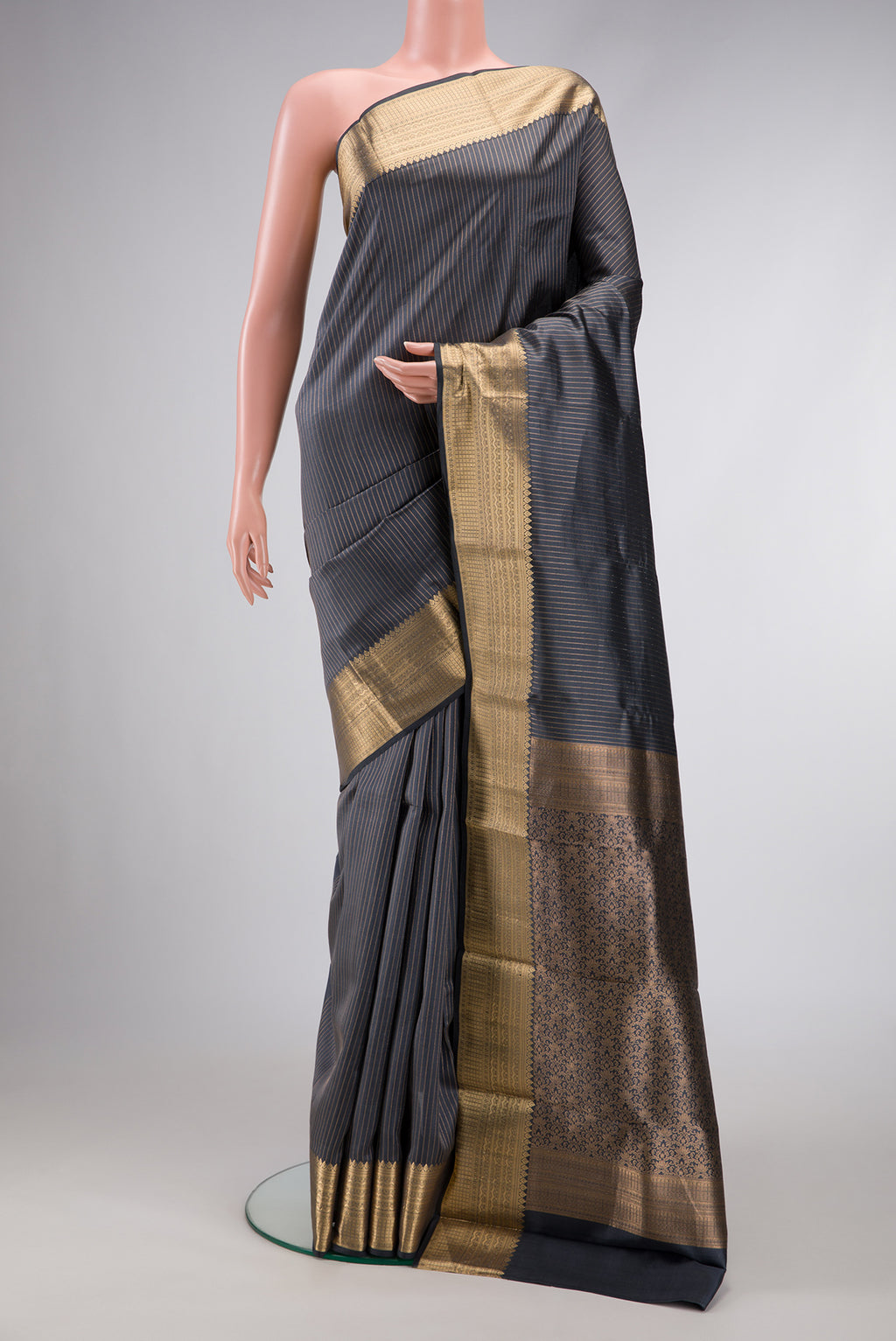 Grey Dual Tone Kanchipuram Silk Saree with Stripes on the body and Zari Border.  displayed on a mannequin