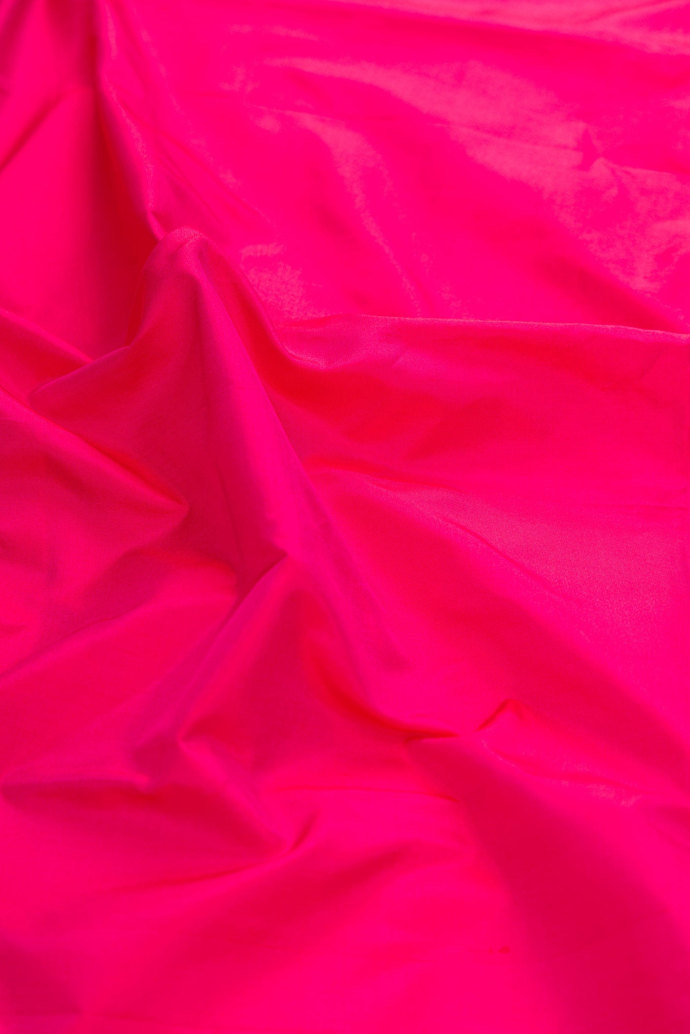 Close up of Pink Bangalore Silk Saree with Plain Body and Temple Border displaying folds