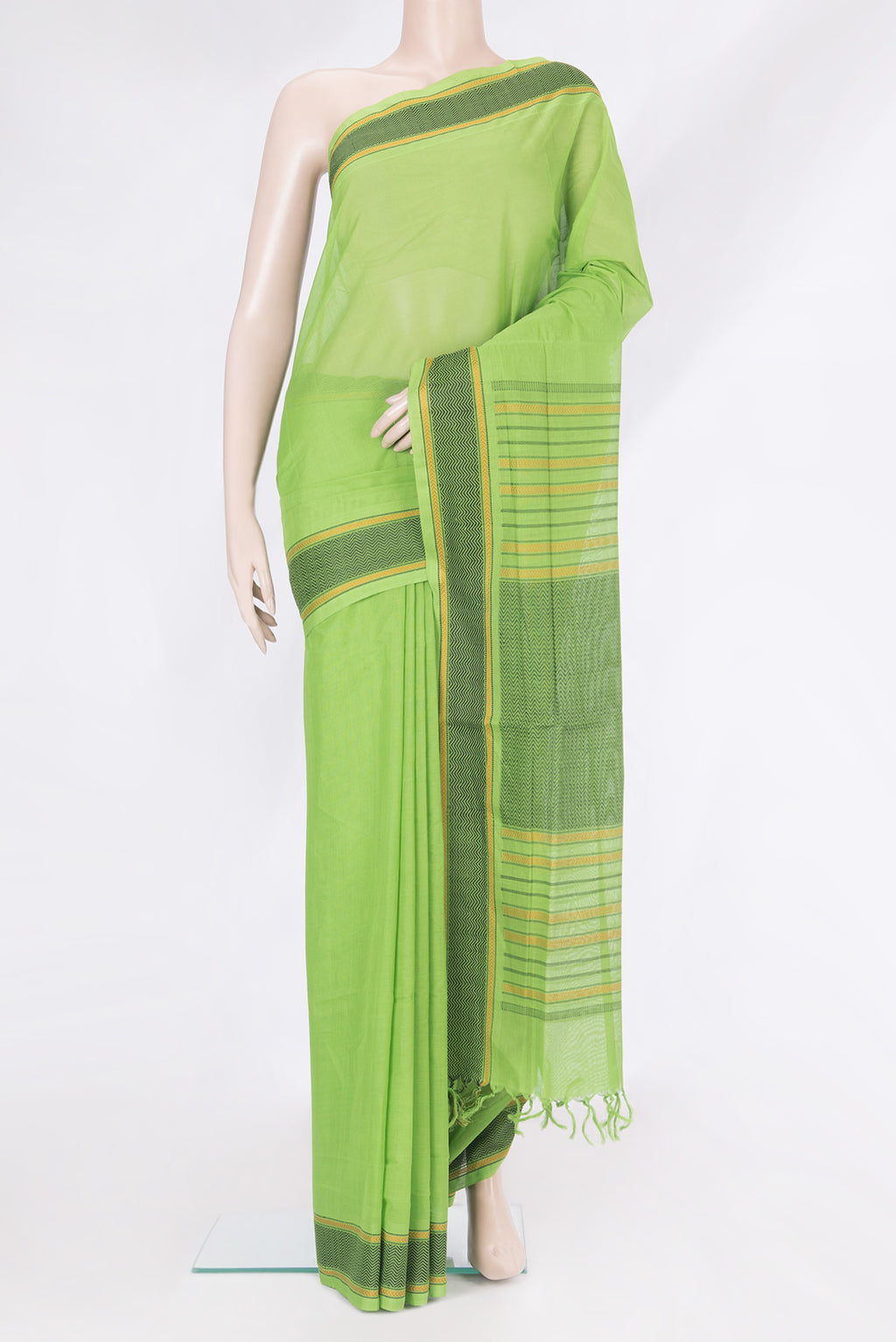 Parrot Green Coimbatore Cotton Saree with Plain Body and Thread Border.  displayed on a mannequin