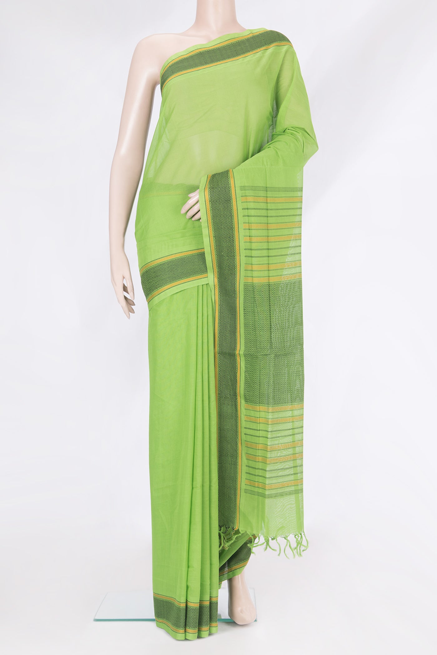 Parrot Green Coimbatore Cotton Saree with Plain Body and Thread Border.  displayed on a mannequin