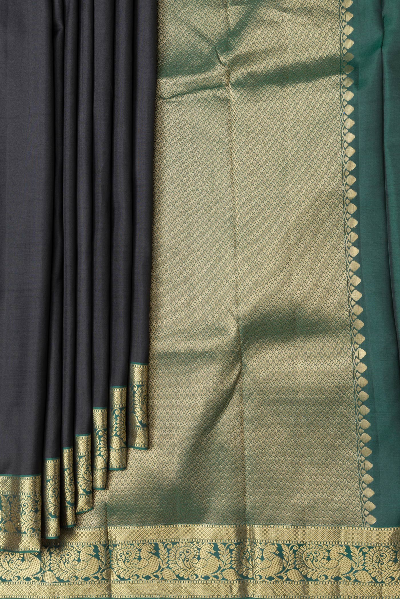 Pleats and pallu of Black Dual Tone Kanjivaram Silk Saree with Plain Body and Zari Border. 