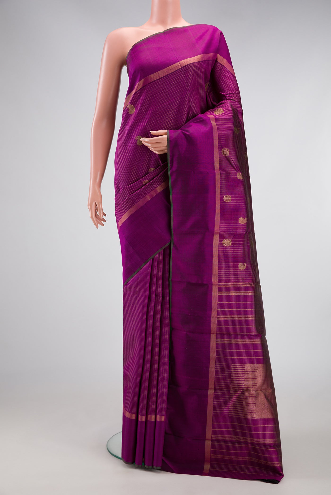 Purple Kanchipuram Silk Saree with Checked design on the body and Zari Border.  displayed on a mannequin