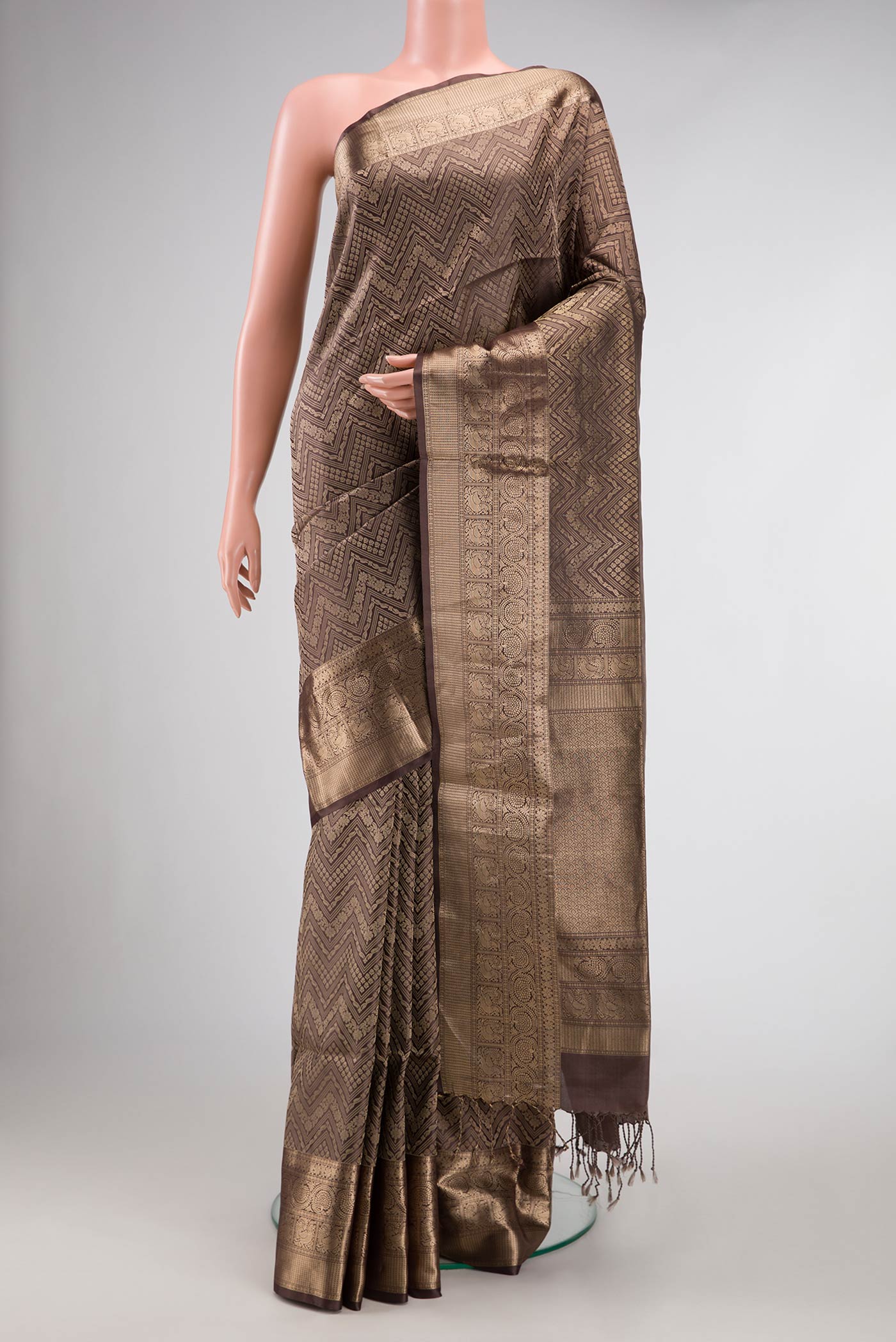 Brown Dual Tone Soft Silk Saree with Zari Brocade on the body and Zari Border.  displayed on a mannequin