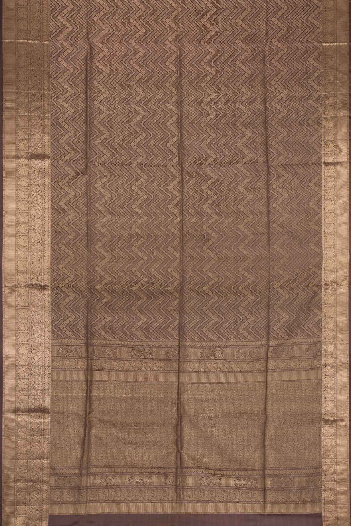 Flat view of Brown Dual Tone Soft Silk Saree with Zari Brocade on the body and Zari Border. 