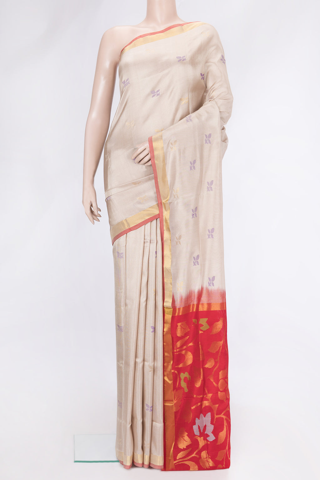 Beige Dual Tone Uppada Silk Saree with Zari And Thread Butta on the body and Zari Border.  displayed on a mannequin