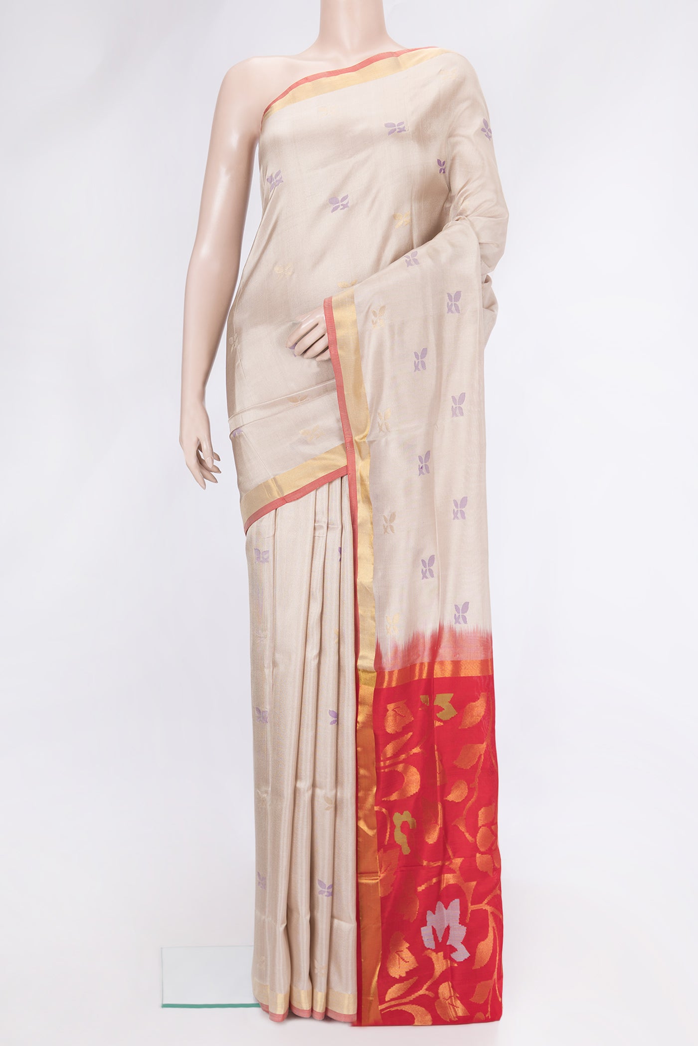 Beige Dual Tone Uppada Silk Saree with Zari And Thread Butta on the body and Zari Border.  displayed on a mannequin