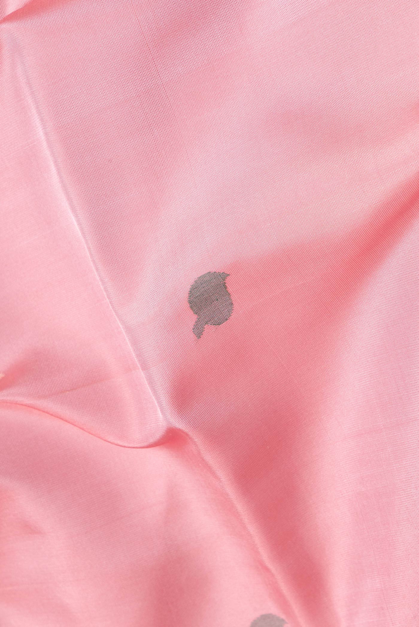 Close up of Pink Dual Tone Uppada Silk Saree with Zari And Thread Butta on the body and Zari Border.  displaying folds