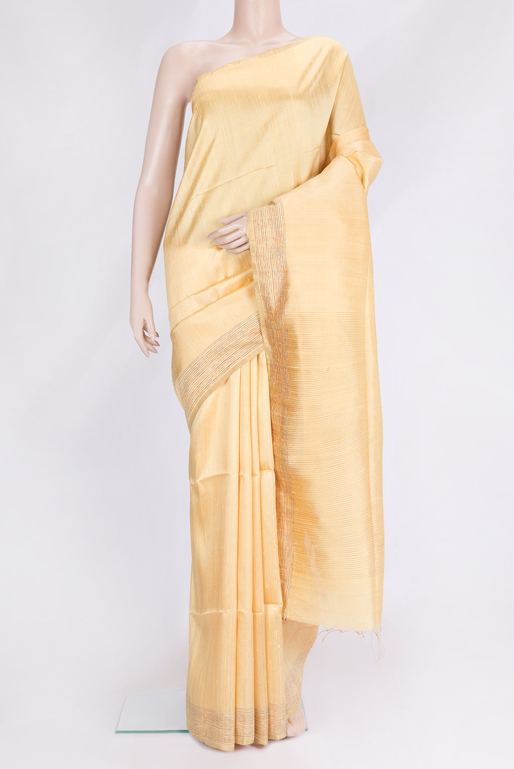 Sandal Dual Tone Raw Silk Saree with Plain Body and Zari And Thread Border.  displayed on a mannequin
