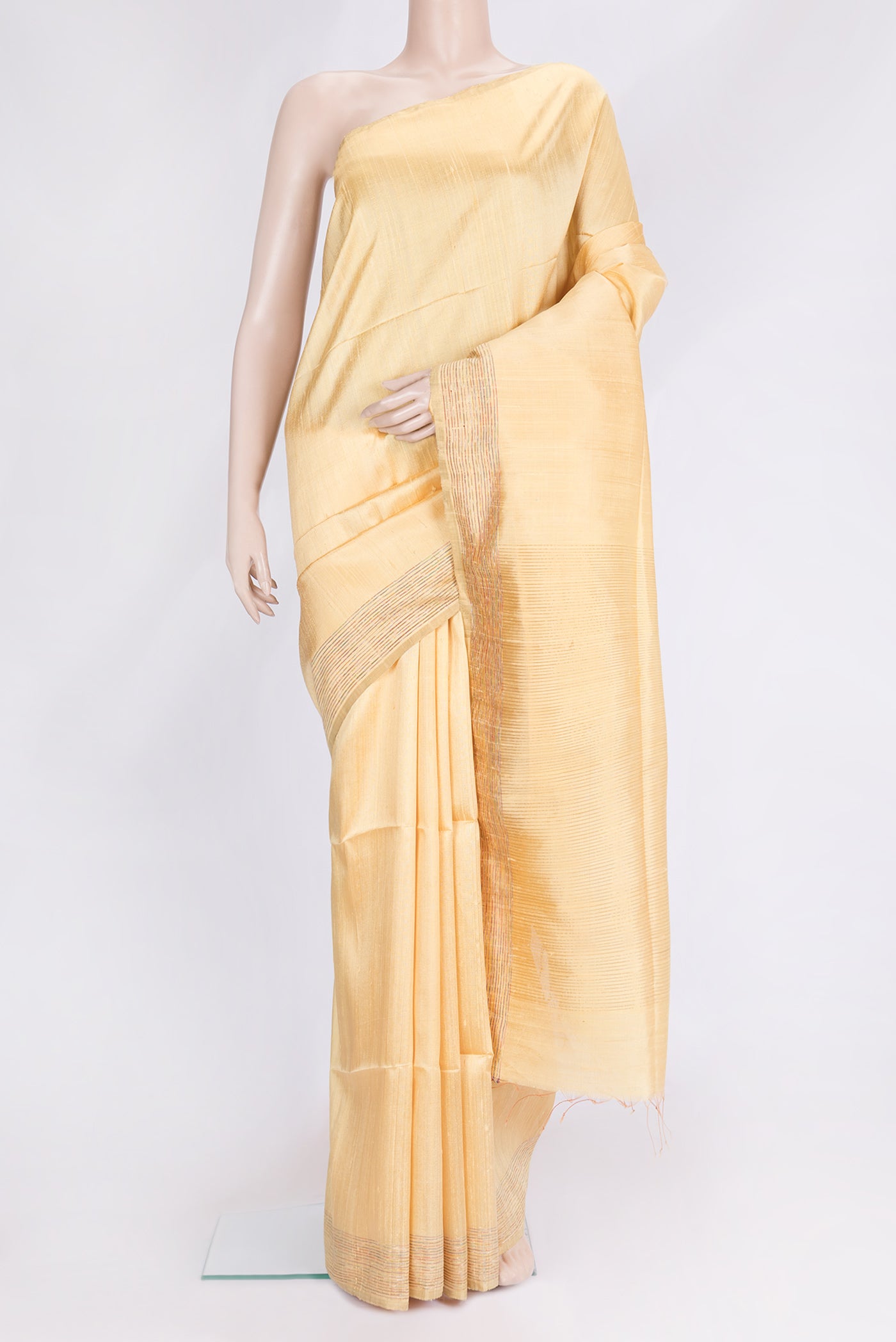 Sandal Dual Tone Raw Silk Saree with Plain Body and Zari And Thread Border.  displayed on a mannequin