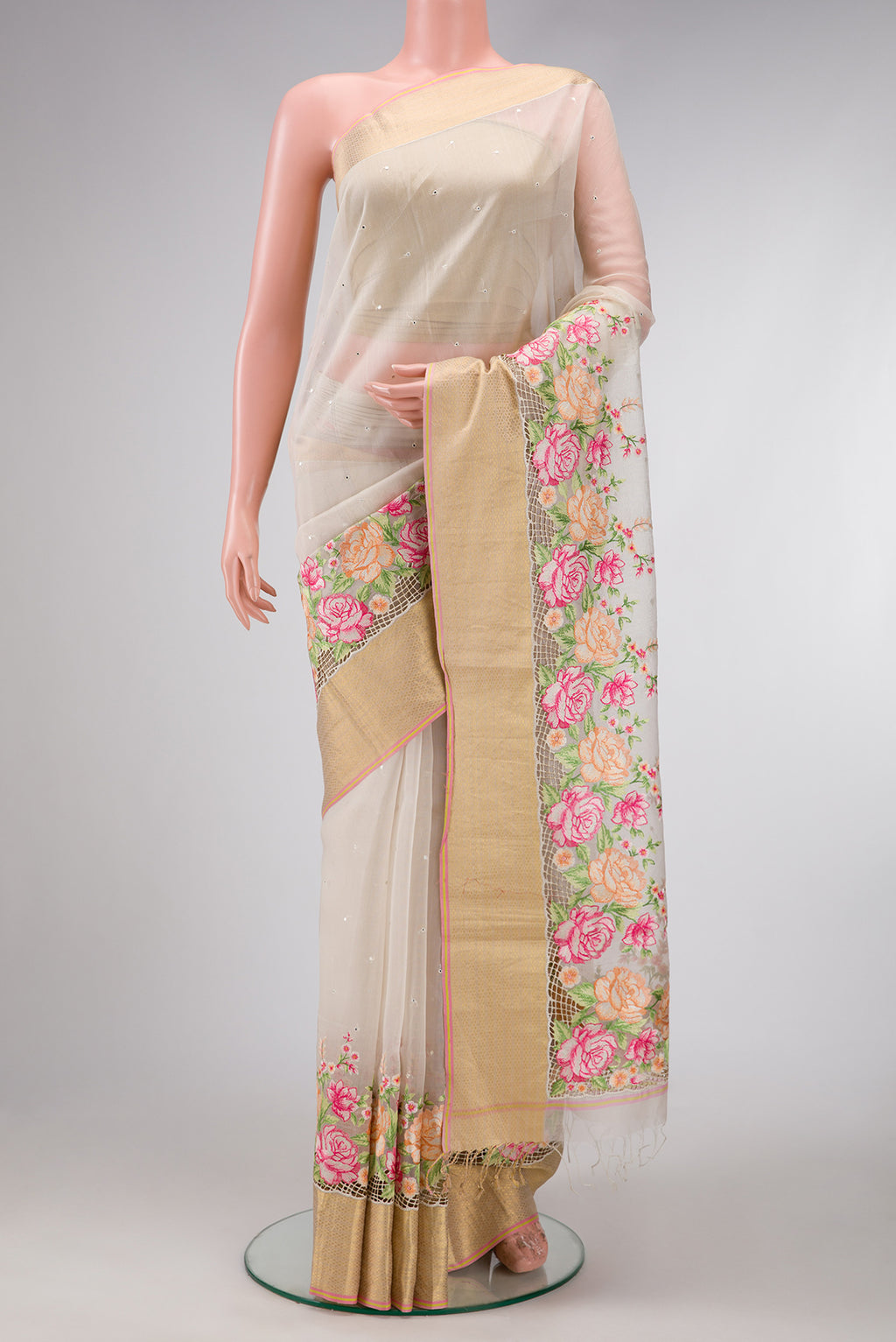 Beige Dual Tone Organza Silk Saree with Embroidery on the body and Embroidery Border.  displayed on a mannequin