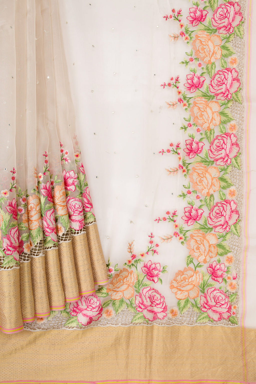 Pleats and pallu of Beige Dual Tone Organza Silk Saree with Embroidery on the body and Embroidery Border. 