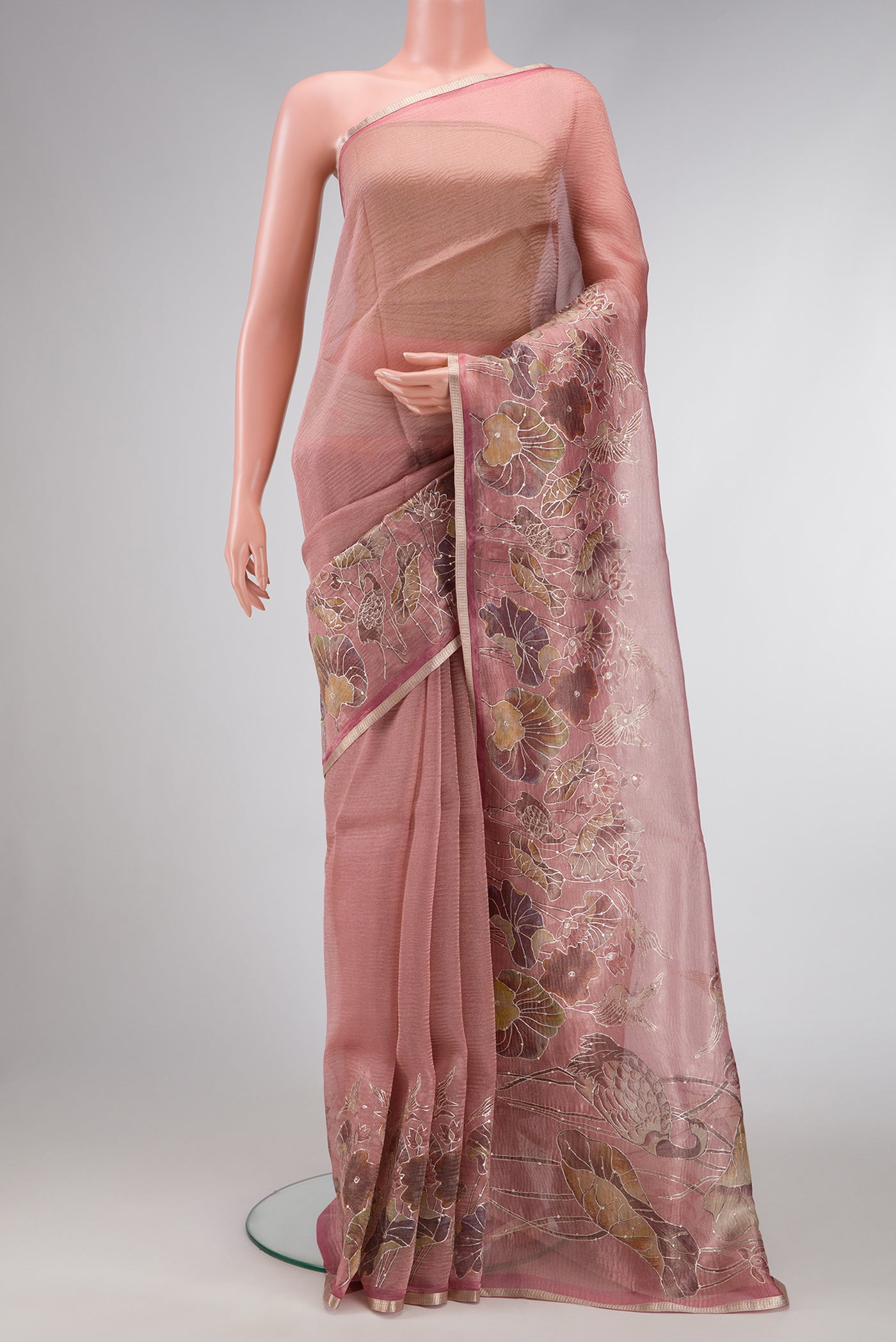 Rose Gold Dual Tone Organza Silk Saree with Plain Body and Embroidery Border.  displayed on a mannequin