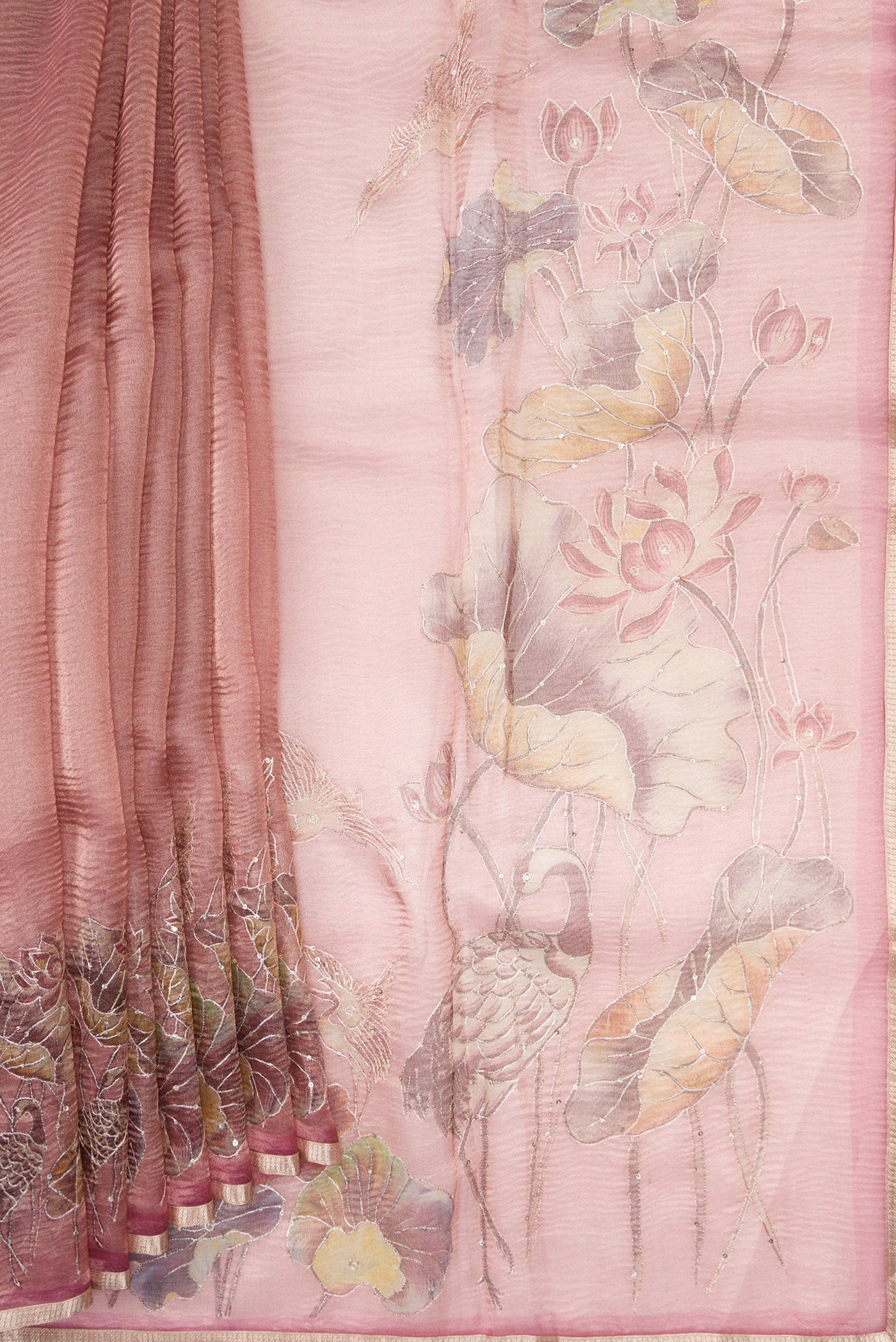 Pleats and pallu of Rose Gold Dual Tone Organza Silk Saree with Plain Body and Embroidery Border. 