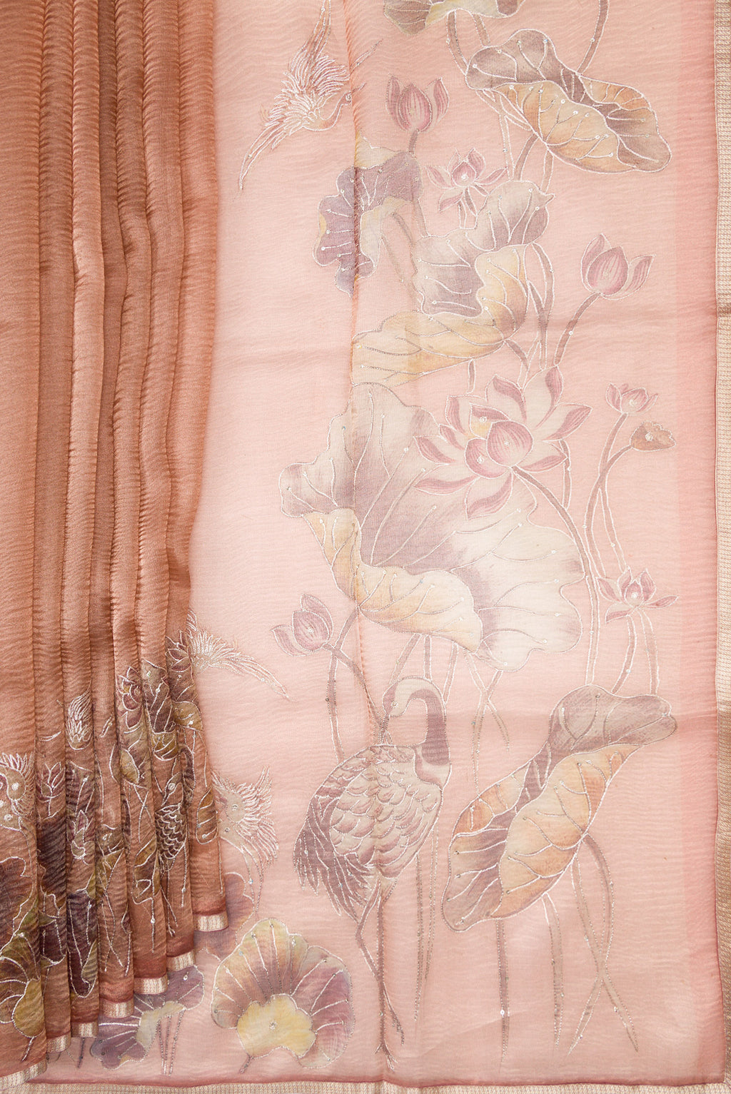 Pleats and pallu of Rose Gold Dual Tone Organza Silk Saree with Plain Body and Embroidery Border. 