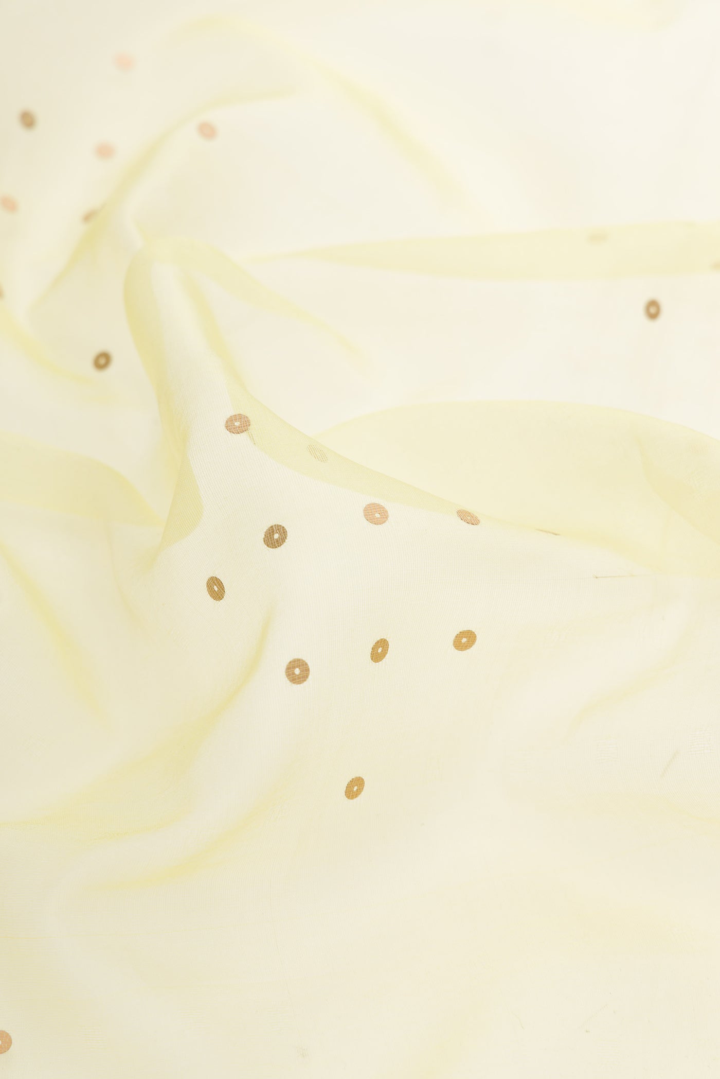 Close up of Lemon Yellow Dual Tone Organza Silk Saree with Embroidery on the body and Embroidery Border.  displaying folds