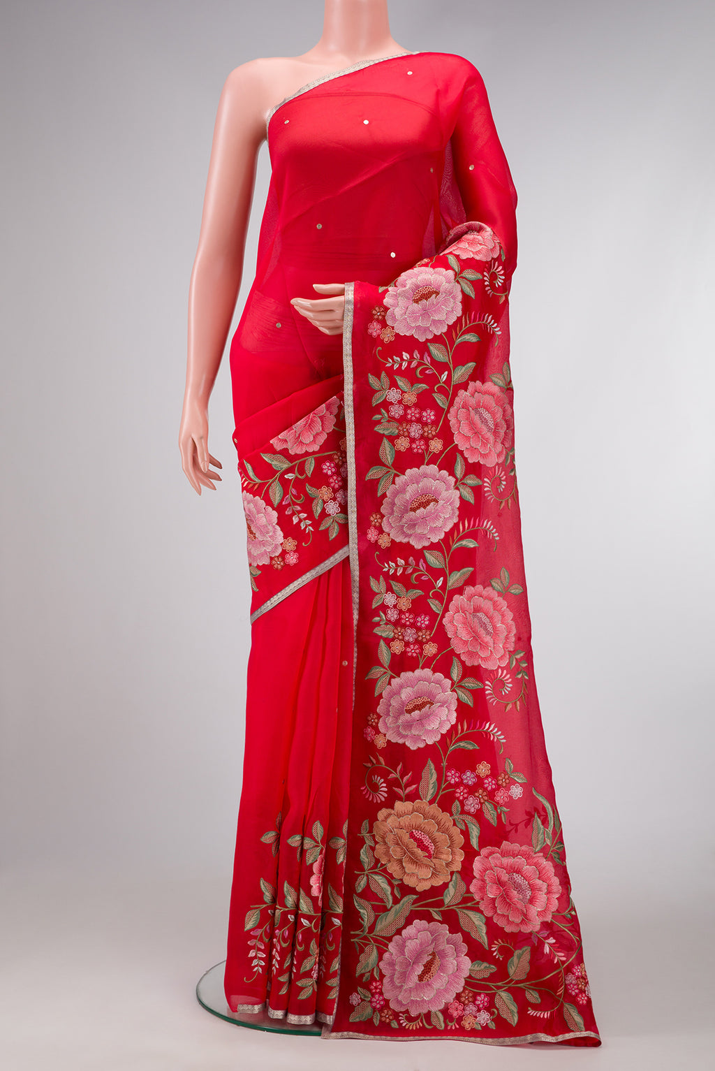 Red Dual Tone Organza Silk Saree with Zari Butta on the body and Embroidery Border.  displayed on a mannequin