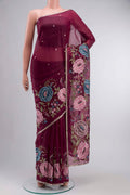 Maroon Organza Silk Saree with Embroidery on the body and Zari Border displayed on a mannequin
