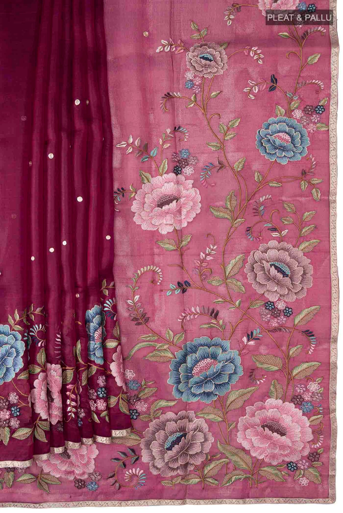 Pleats and pallu of Maroon Organza Silk Saree with Embroidery on the body and Zari Border