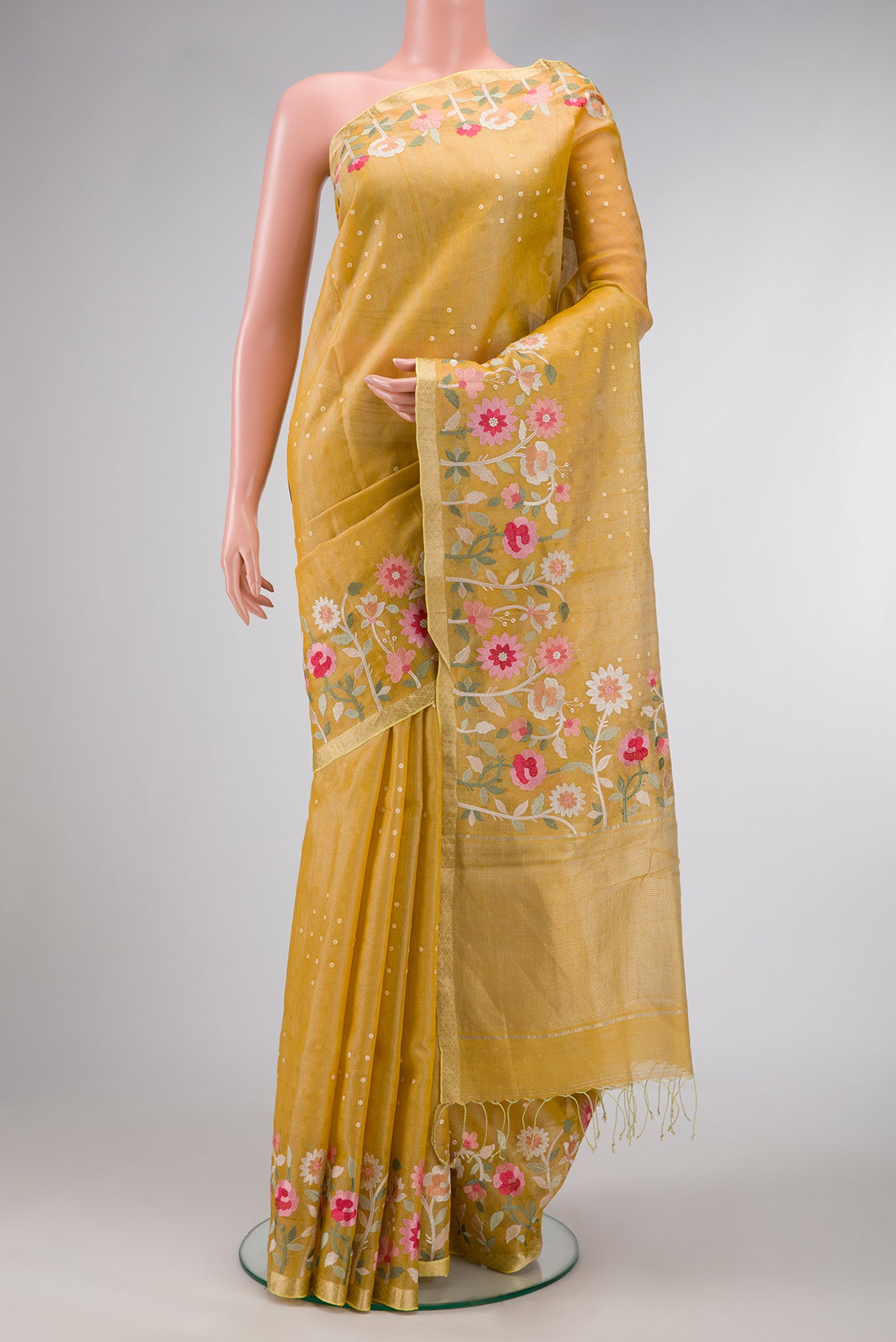 Gold Dual Tone Tussar Silk Saree with Zari Butta on the body and Embroidery Border.  displayed on a mannequin