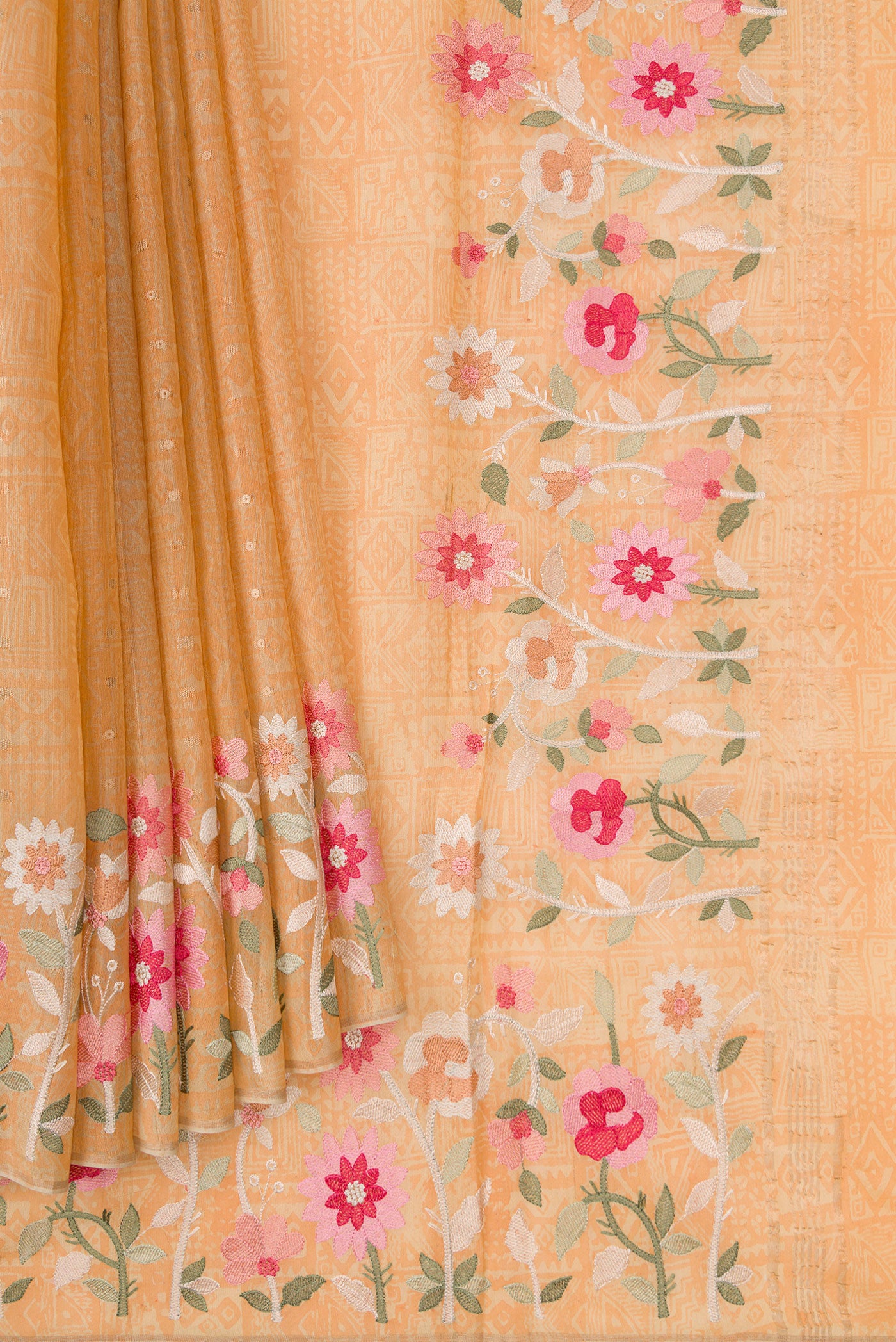 Pleats and pallu of Beige Dual Tone Organza Silk Saree with Printed design on the body and Embroidery Border. 