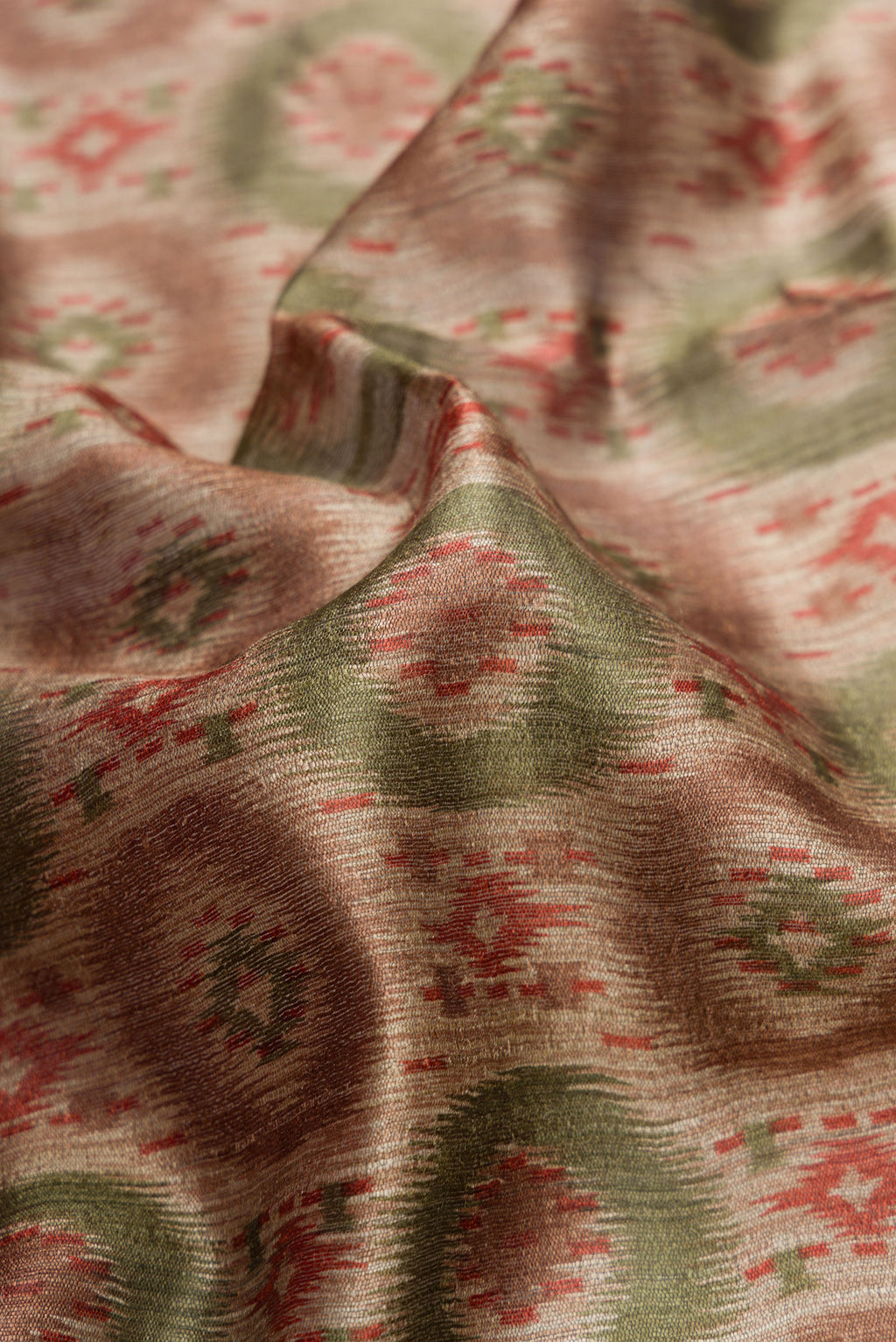 Close up of Dark Beige Dual Tone Tussar Silk Saree with Printed design on the body and Zari Border.  displaying folds