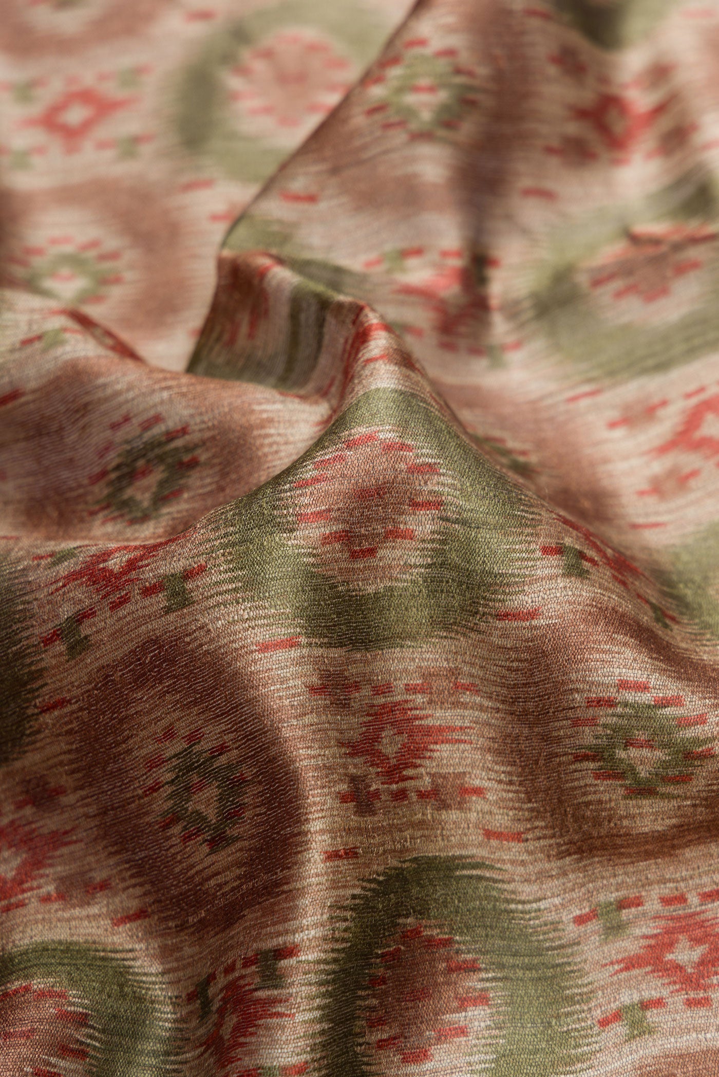 Close up of Dark Beige Dual Tone Tussar Silk Saree with Printed design on the body and Zari Border.  displaying folds