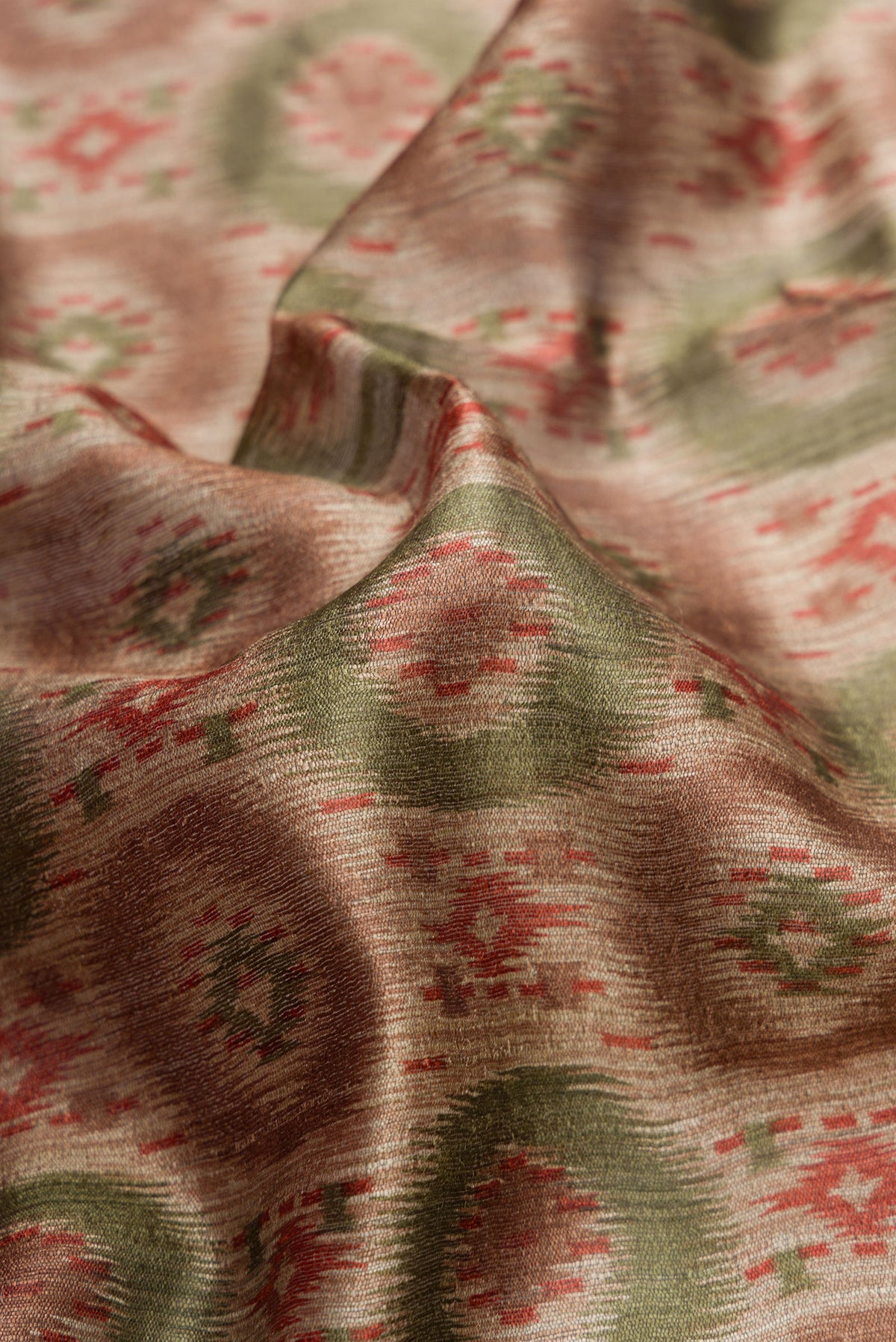 Close up of Dark Beige Dual Tone Tussar Silk Saree with Printed design on the body and Zari Border.  displaying folds