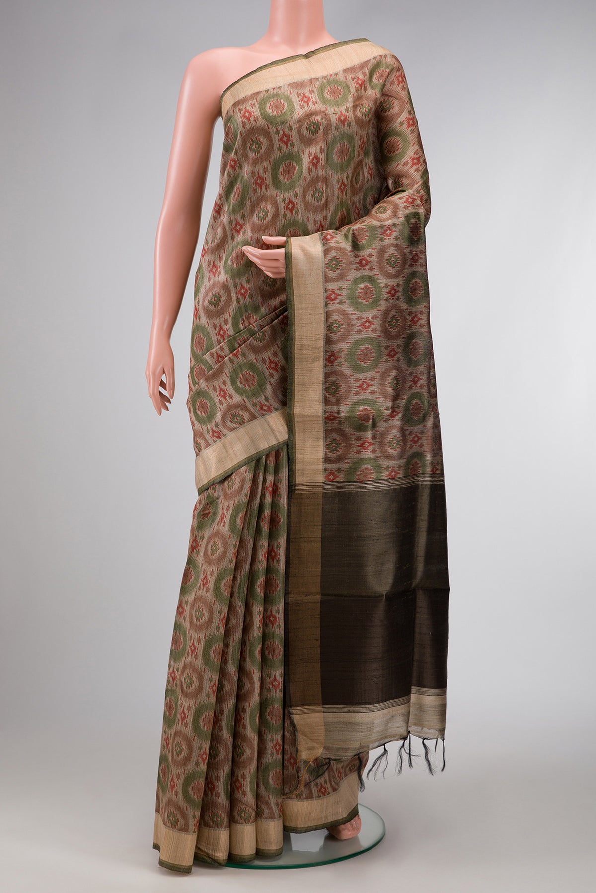 Dark Beige Dual Tone Tussar Silk Saree with Printed design on the body and Zari Border.  displayed on a mannequin