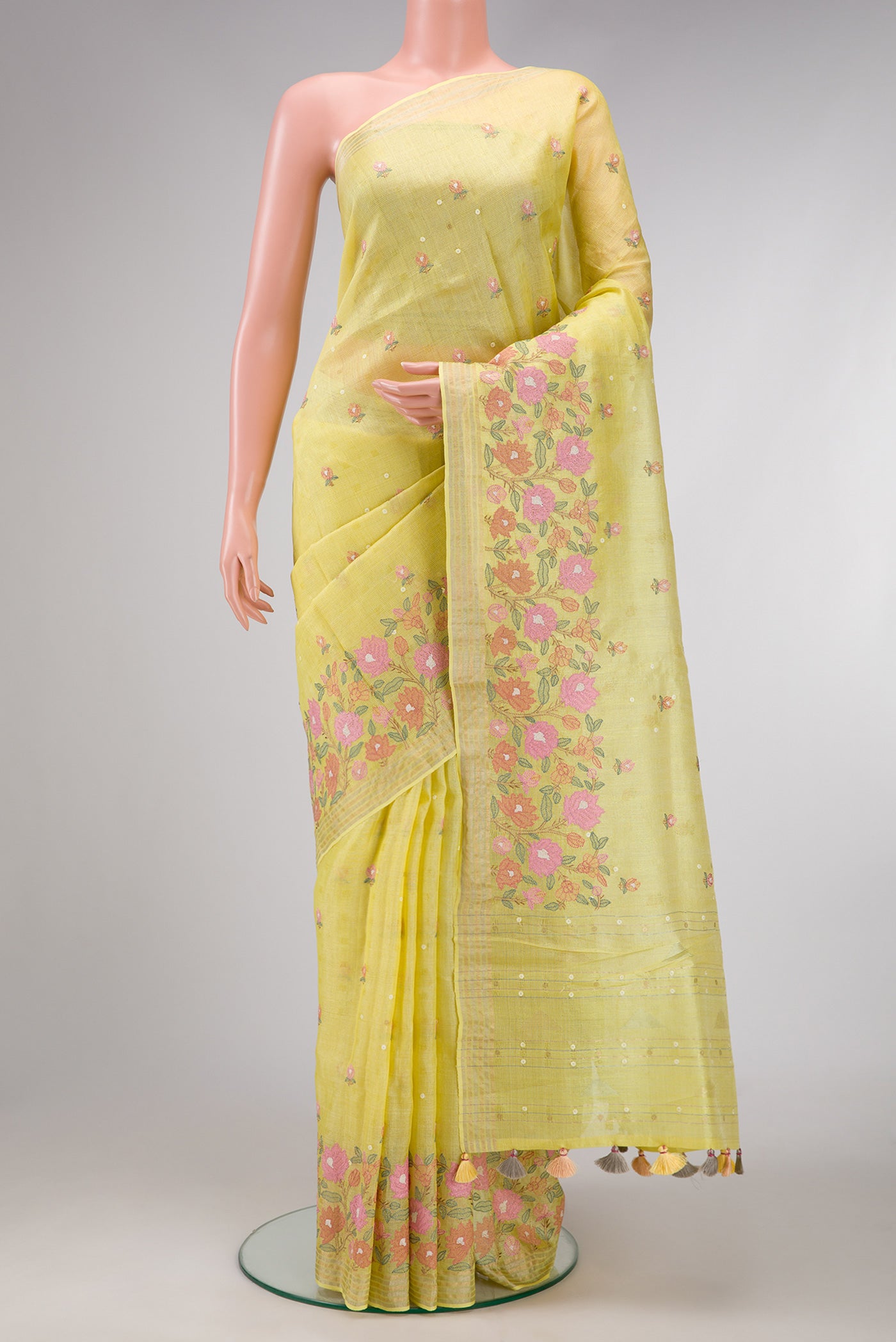 Lemon Yellow Dual Tone Tussar Silk Saree with Embroidery on the body and Fancy Border.  displayed on a mannequin