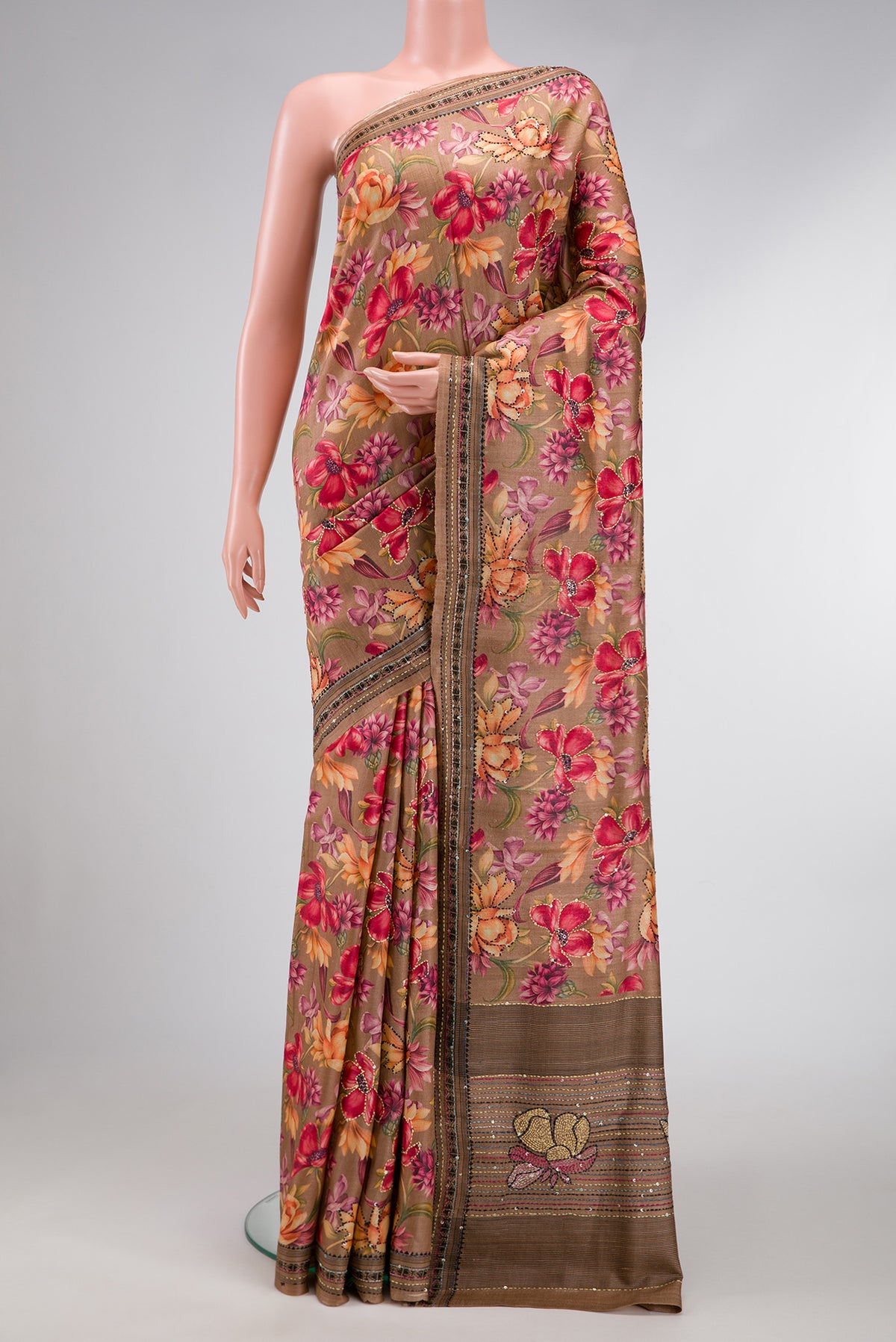 Brown Dual Tone Tussar Saree with Printed design on the body and Embroidery Border.  displayed on a mannequin