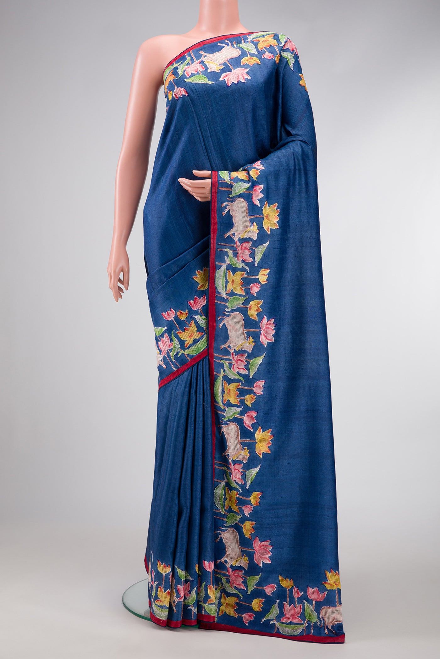 Navy Blue Dual Tone Tussar Silk Saree with Plain Body and Embroidery Border.  displayed on a mannequin