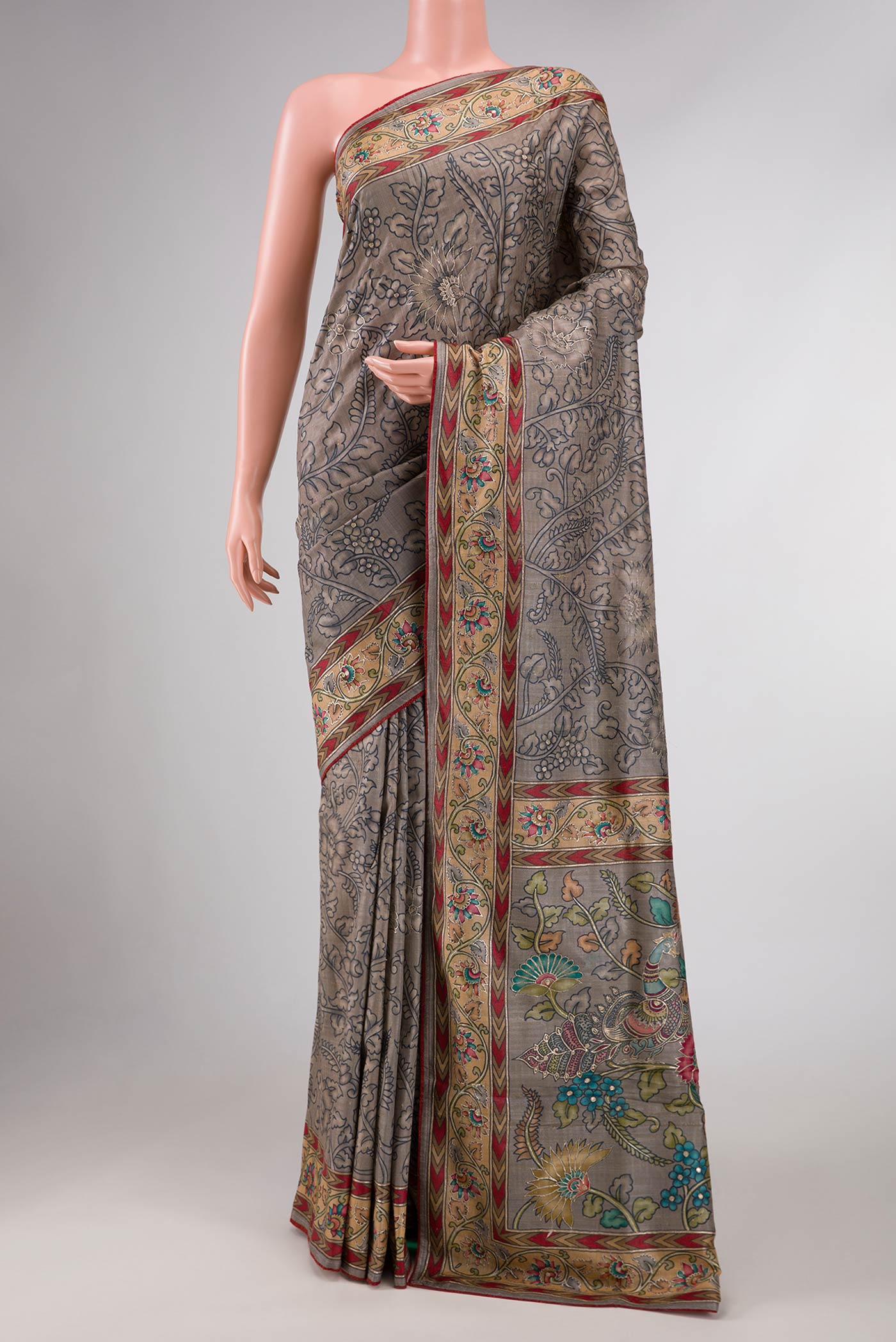 Grey Dual Tone Tussar Silk Saree with Printed design on the body and Embroidery Border displayed on a mannequin