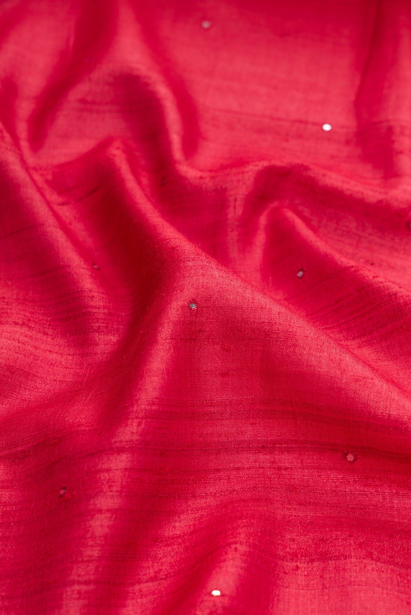 Close up of Pink Dual Tone Tussar Silk Saree with Embroidery on the body and Embroidery Border.  displaying folds