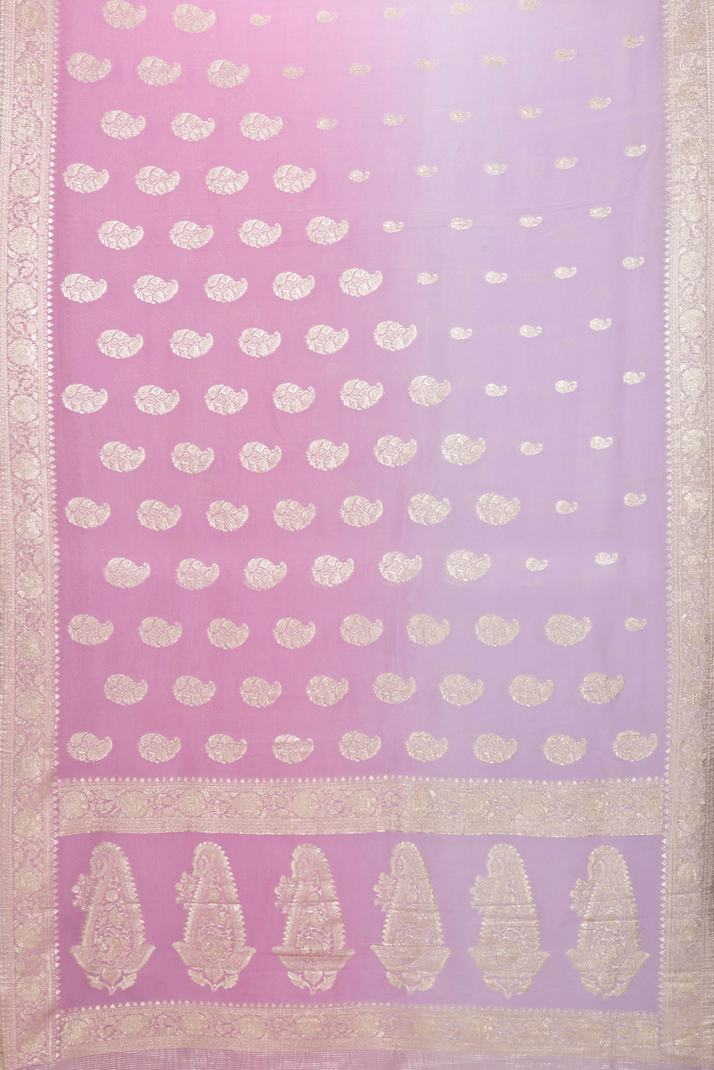Flat view of Pink and Lavender Color Blended Mysore Georgette Saree with Zari Butta on the body and Zari Border. 