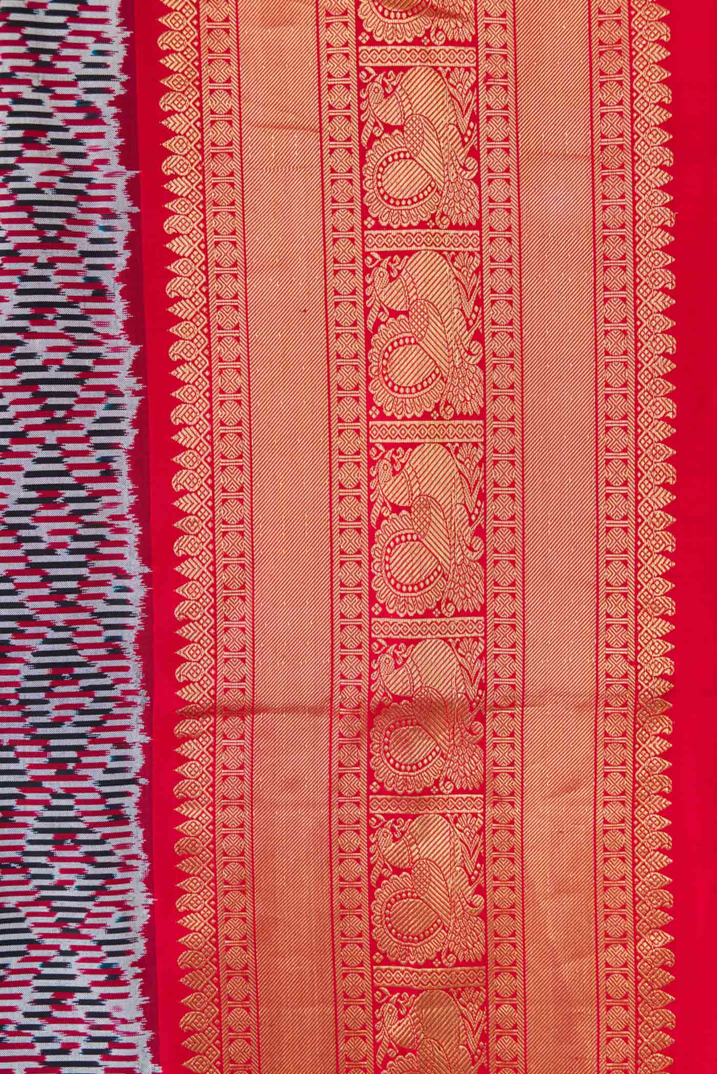 Border image of Burgundy Dual Tone Double Ikat Saree with Ikat Print on the body and Zari Border