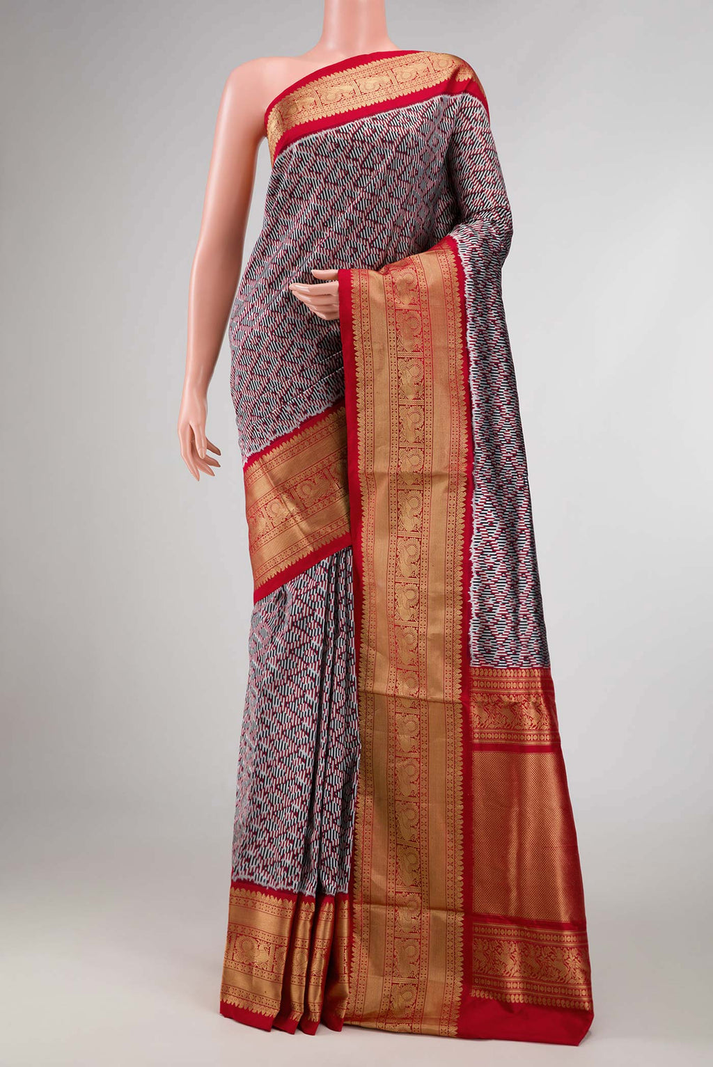 Burgundy Dual Tone Double Ikat Saree with Ikat Print on the body and Zari Border displayed on a mannequin