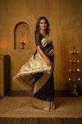 Model wearing a Coffee Brown Paithani Silk Saree with Zari Butta on the body and Paithani Border.
