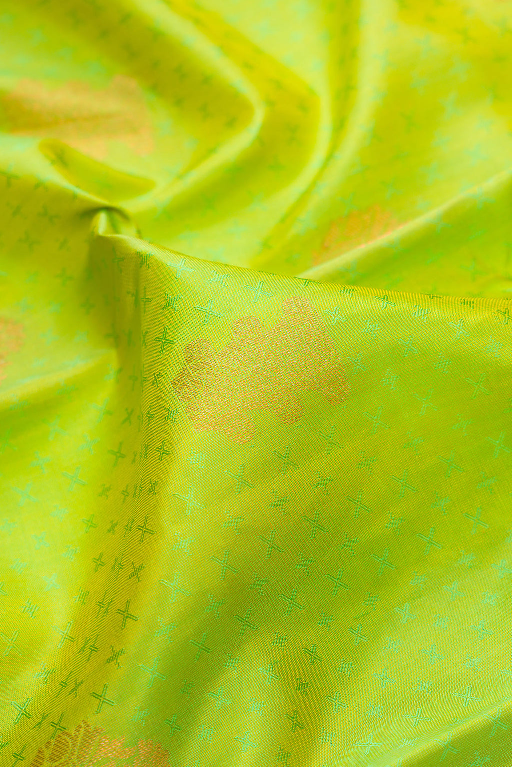 Close up of Parrot Green Dual Tone Kanchipuram Silk Saree with Jacquard With Zari Butta on the body and Zari Border.  displaying folds