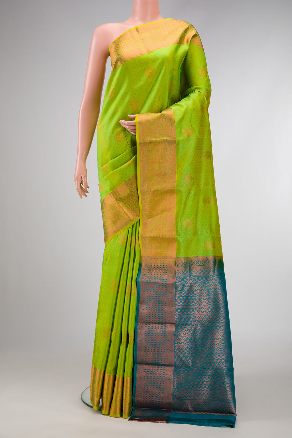 Parrot Green Dual Tone Kanchipuram Silk Saree with Jacquard With Zari Butta on the body and Zari Border.  displayed on a mannequin