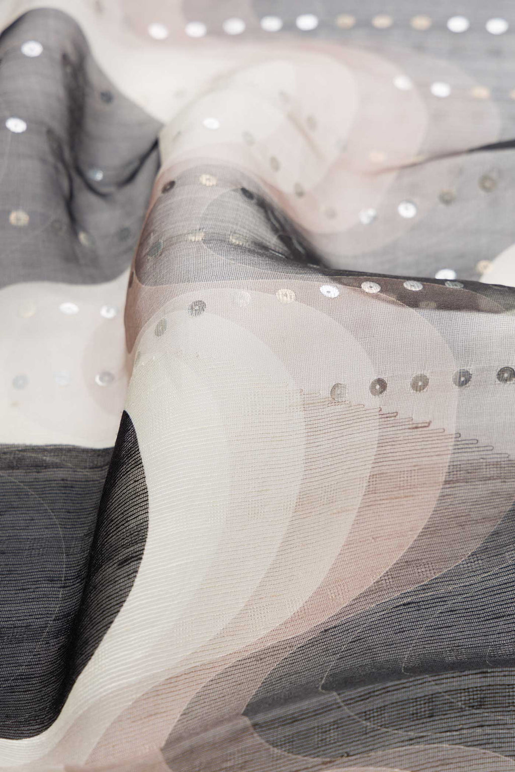 Close up of Black Dual Tone Tussar Silk Saree with Embroidery on the body and Without Border displaying folds