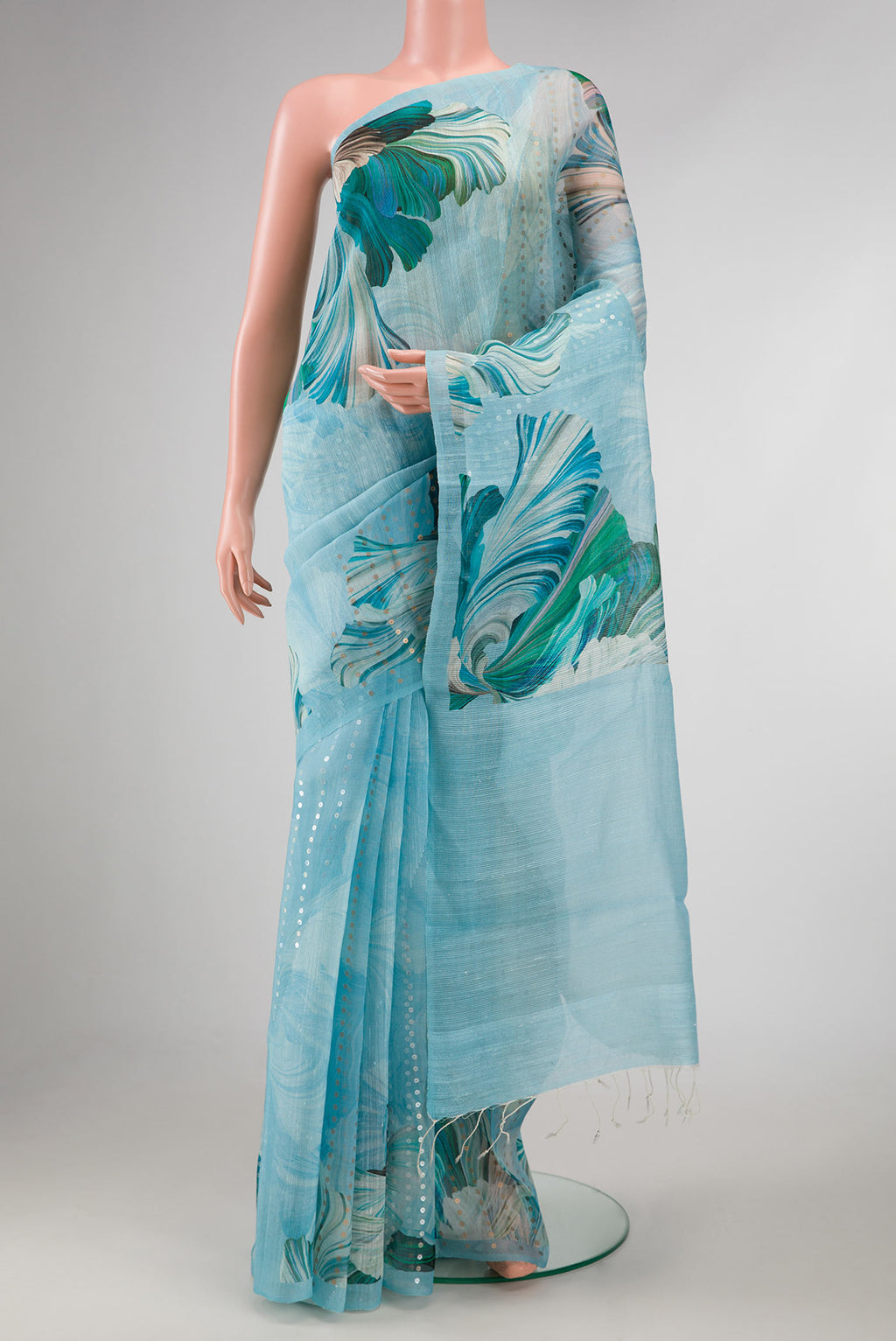 Light Blue Dual Tone Tussar Silk Saree with Embroidery on the body and Without Border displayed on a mannequin