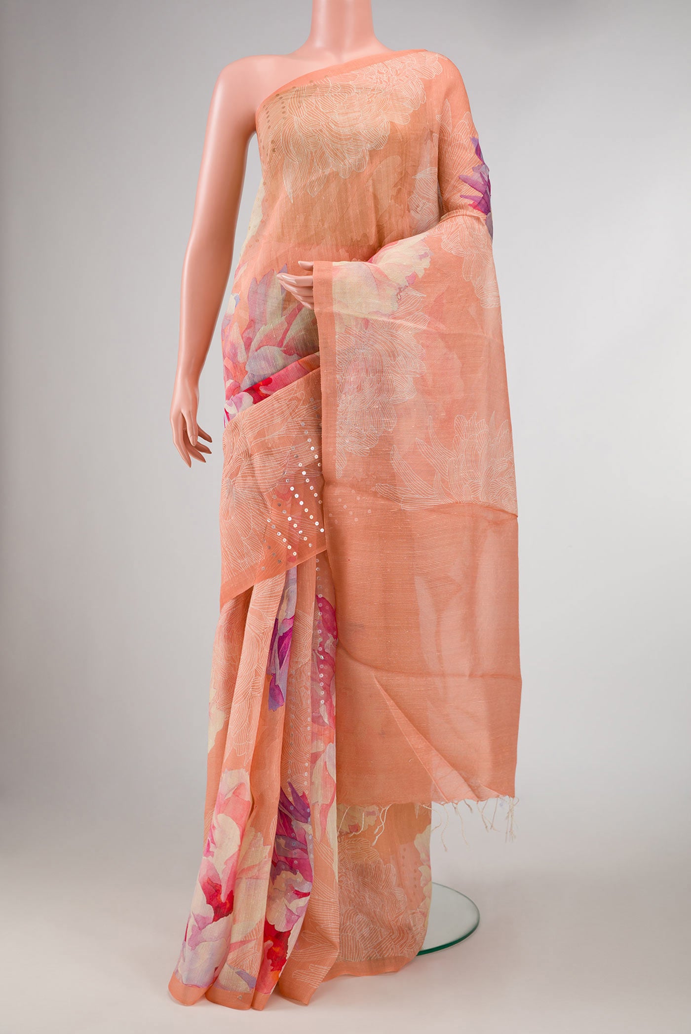 Peach Dual Tone Tussar Silk Saree with Embroidery on the body and Embroidery Border displayed on a mannequin