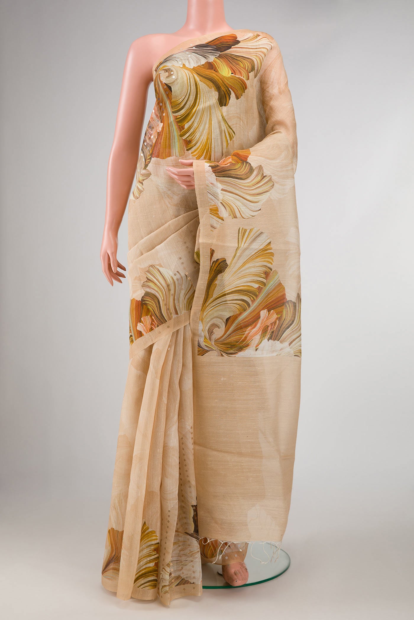 Beige Dual Tone Tussar Silk Saree with Embroidery on the body and Without Border displayed on a mannequin